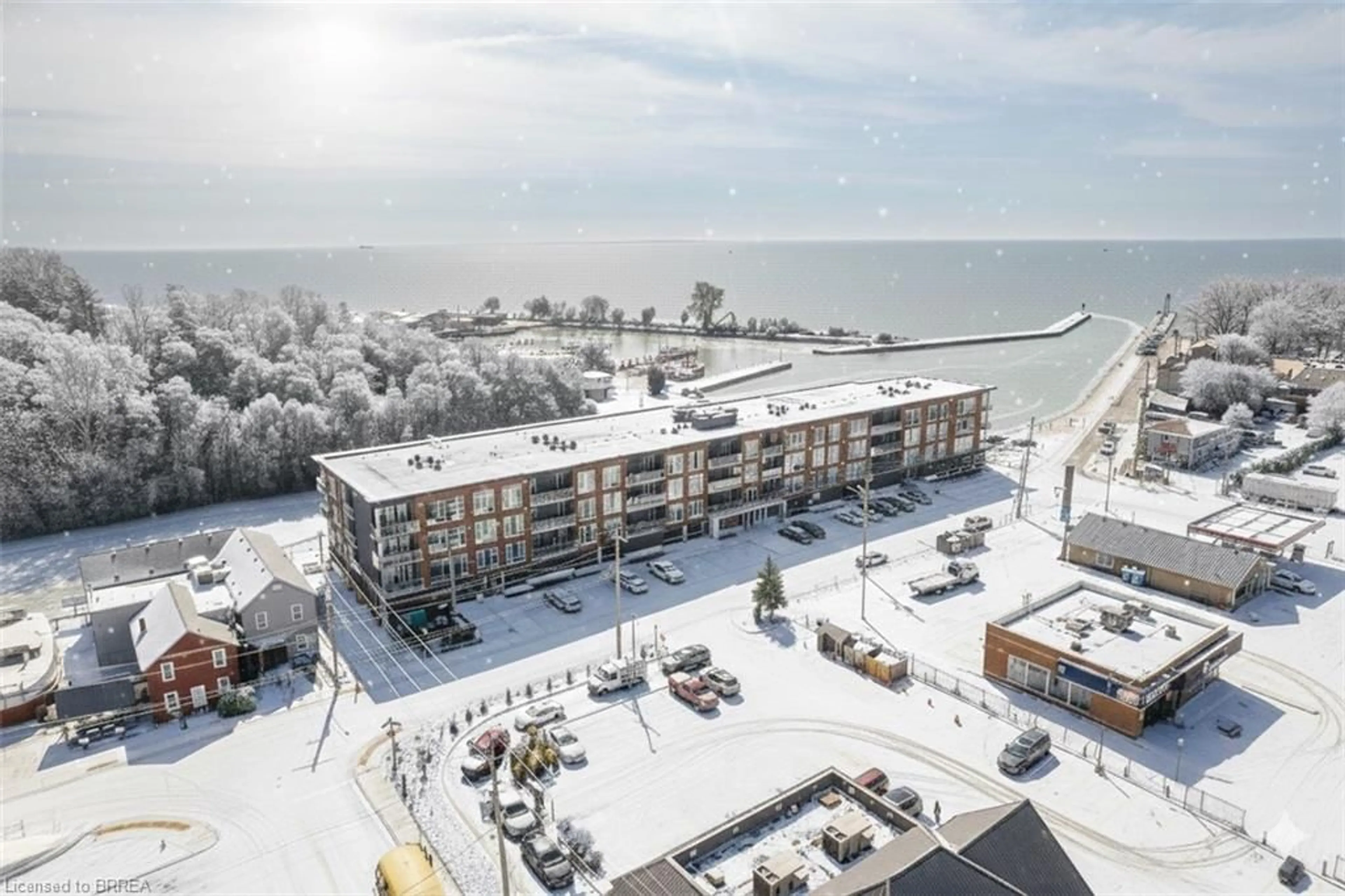 A pic from outside/outdoor area/front of a property/back of a property/a pic from drone, water/lake/river/ocean view for 38 Harbour St #306, Port Dover Ontario N0A 1N0