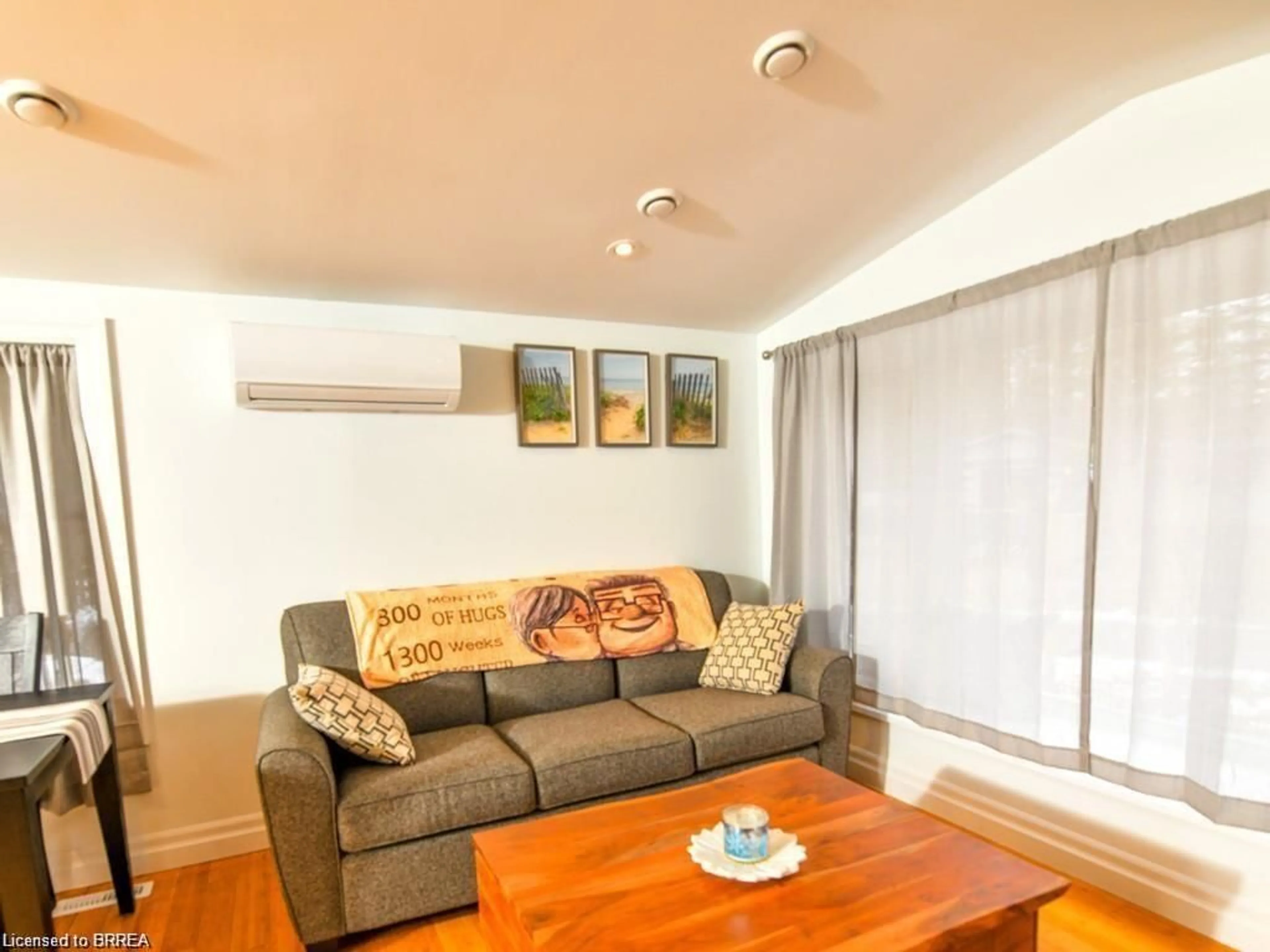 Living room with furniture, wood/laminate floor for 107 Rodeo Rd, Flamborough Ontario N0B 2J0