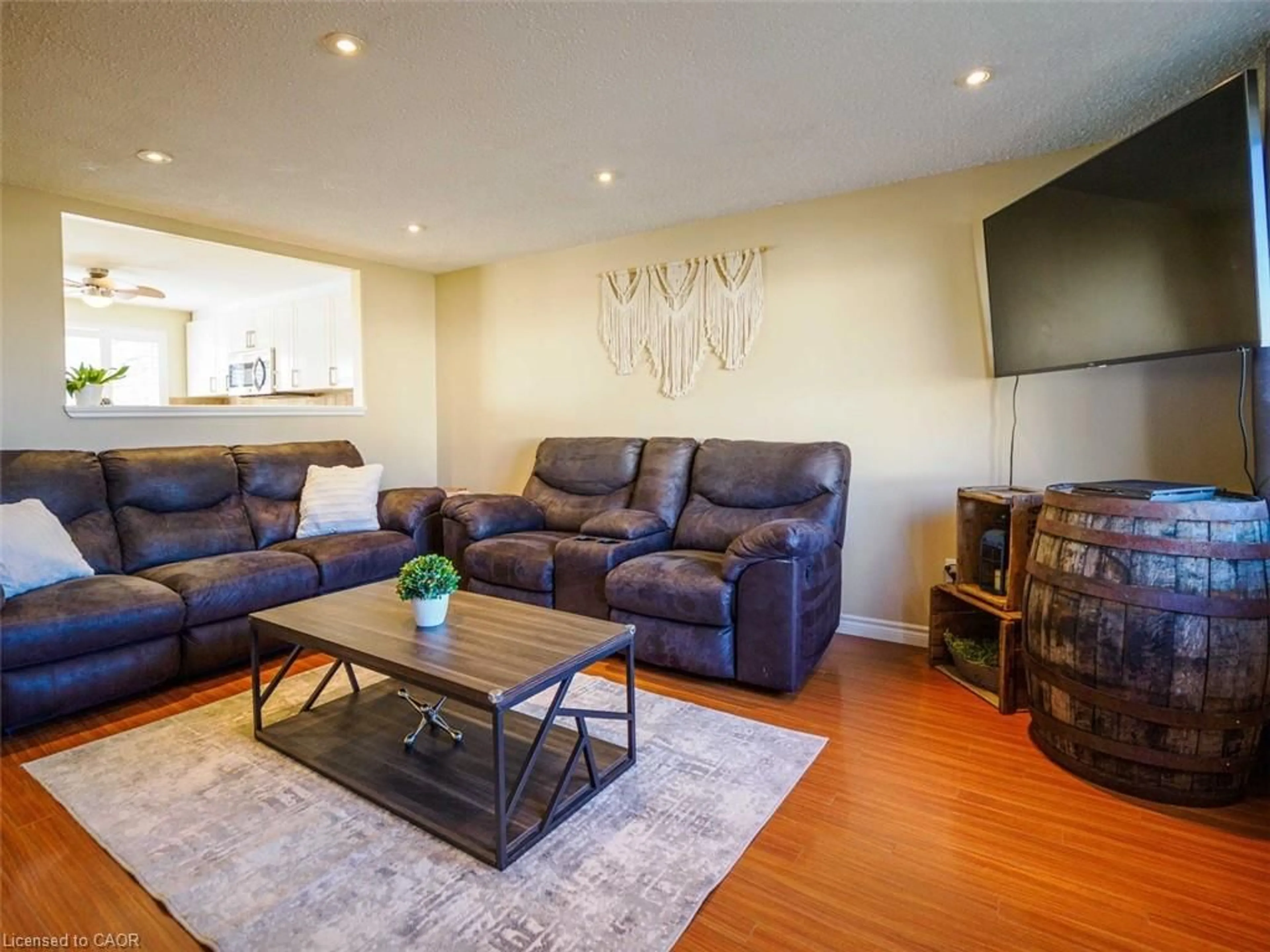 Living room with furniture, wood/laminate floor for 242 Richardson Dr, Port Dover Ontario N0A 1N4