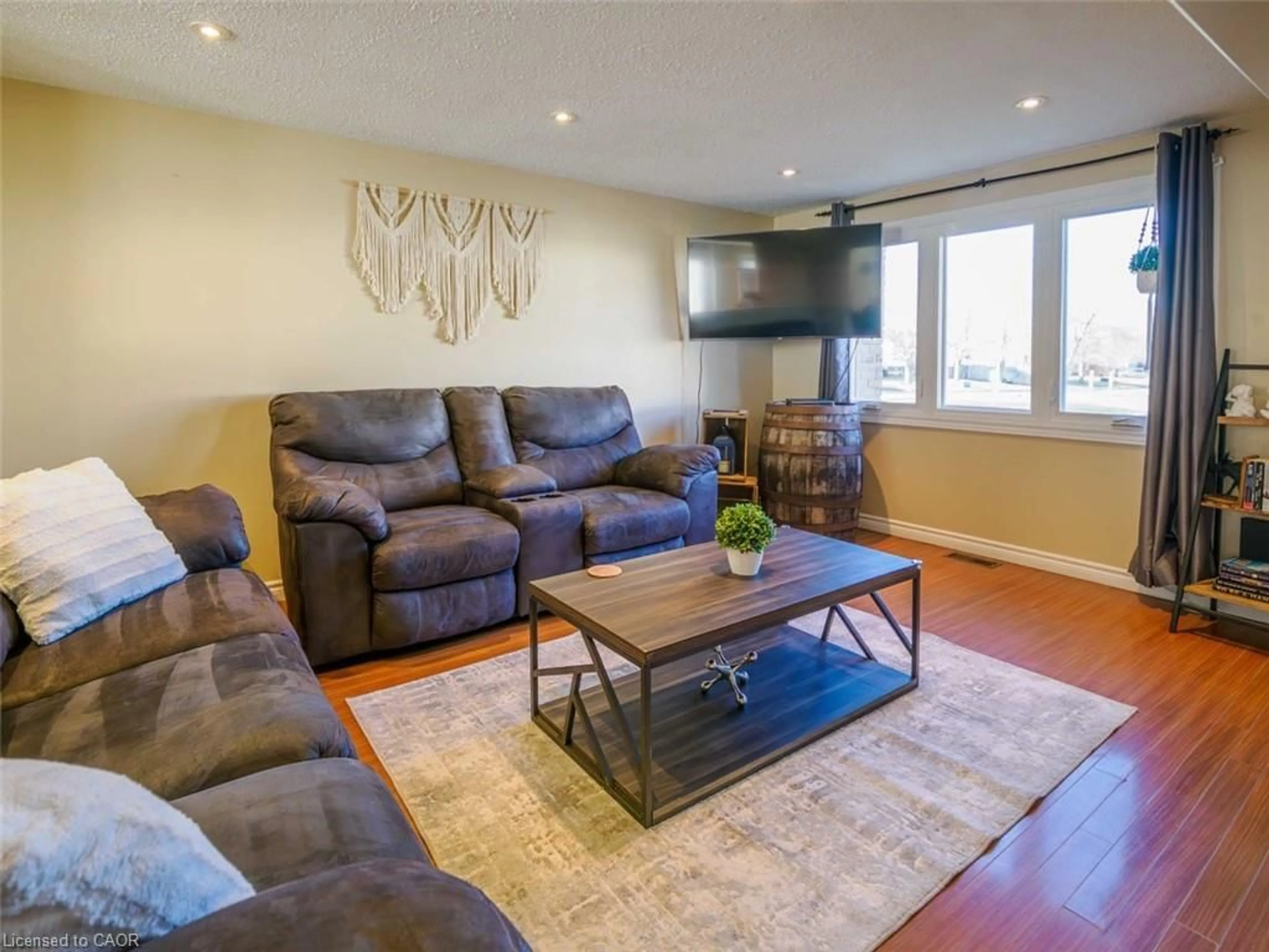 Living room with furniture, wood/laminate floor for 242 Richardson Dr, Port Dover Ontario N0A 1N4