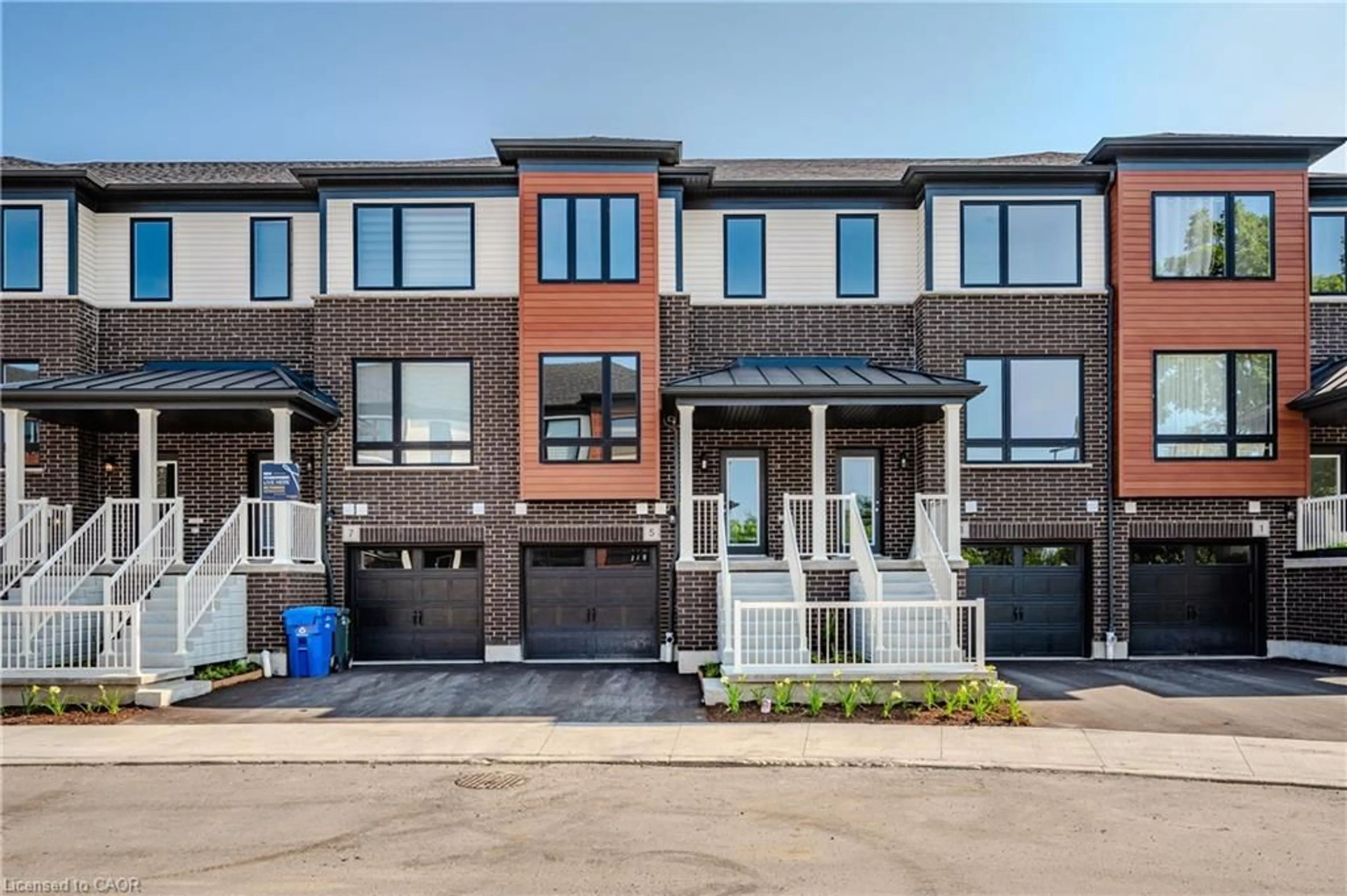 Home with brick exterior material, street for 2 Sora Lane, Guelph Ontario N1E 0T4