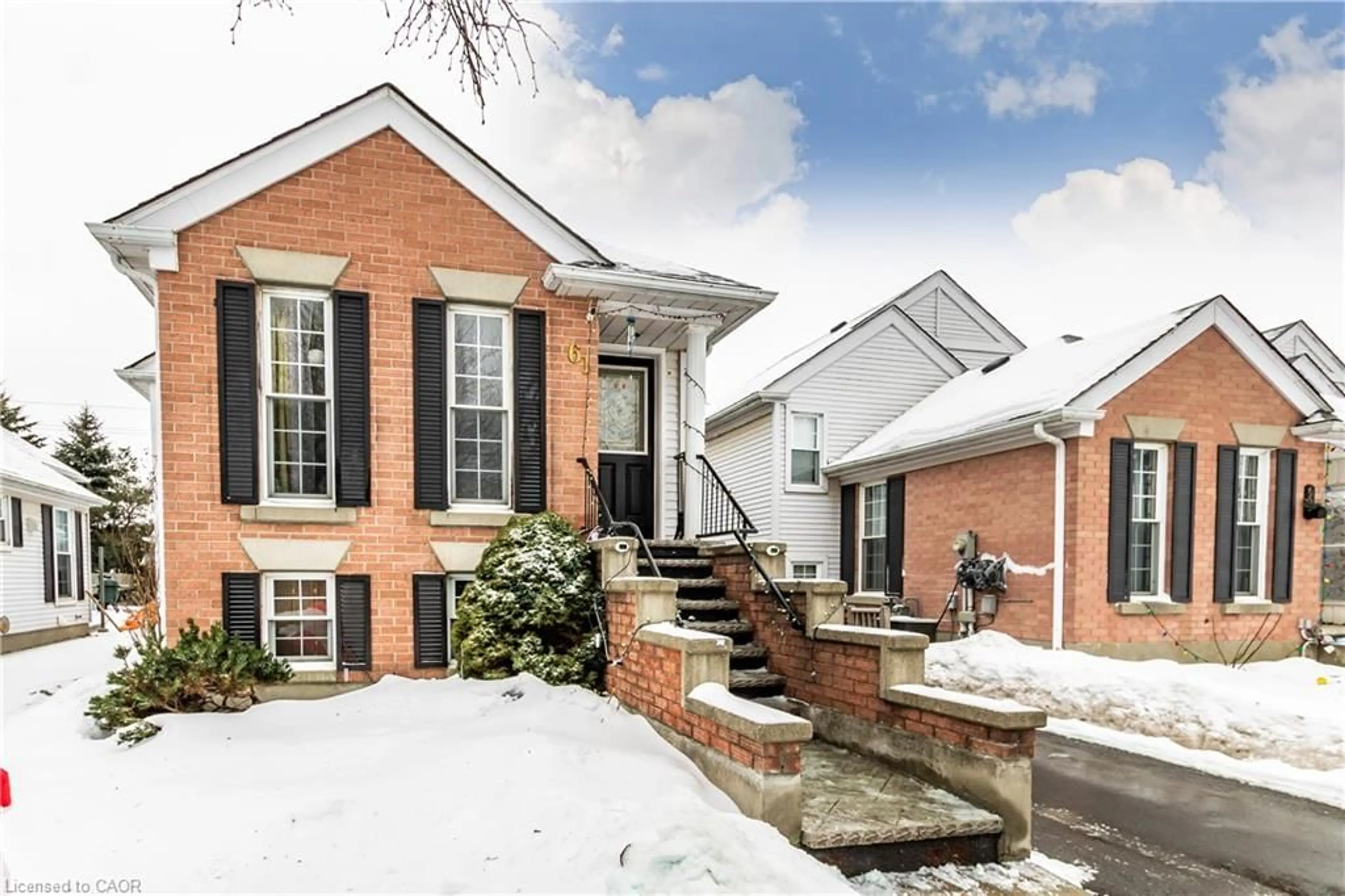 Home with brick exterior material, street for 61 Wake Robin Dr, Kitchener Ontario N2E 3L4