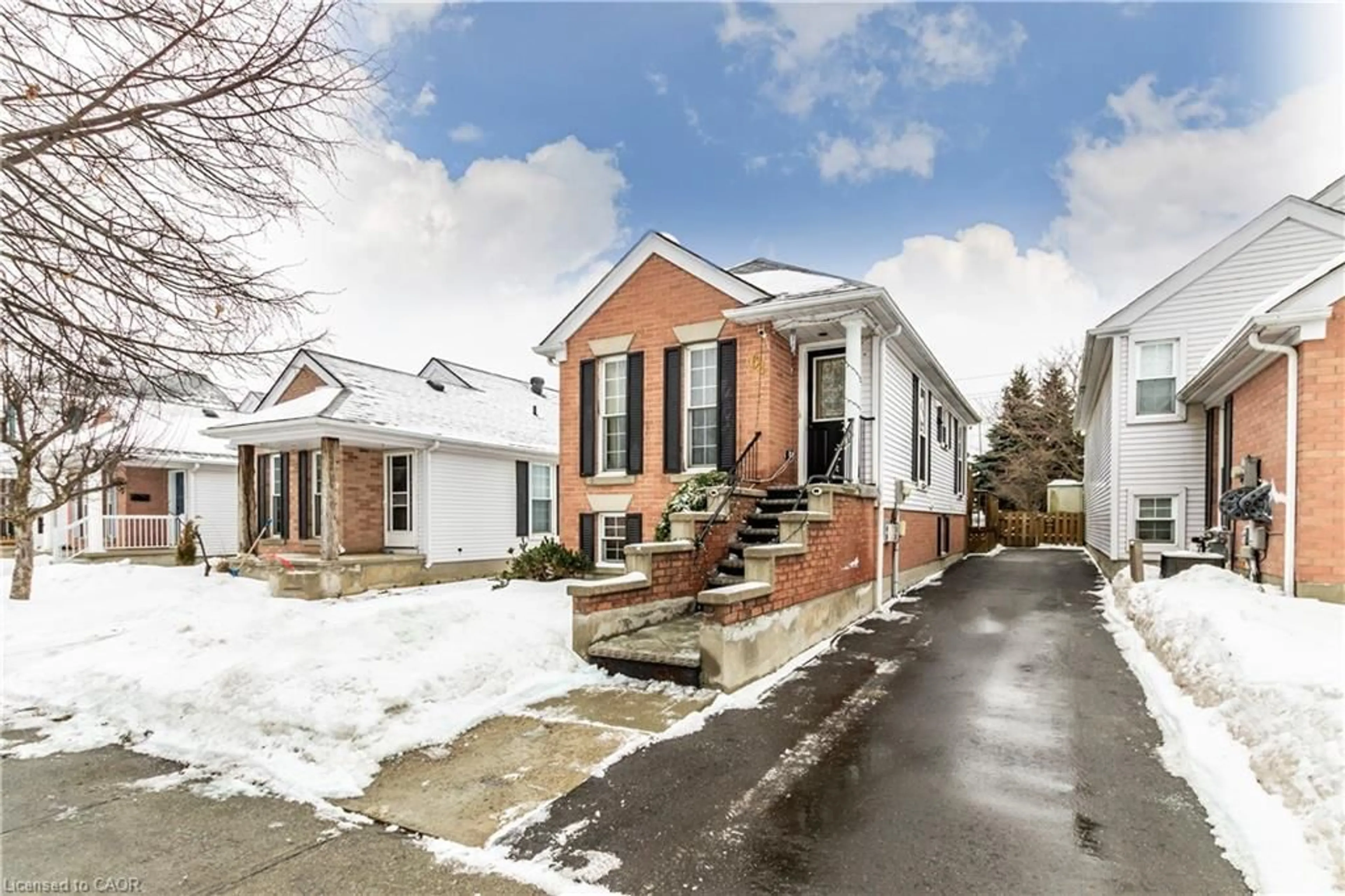 Home with brick exterior material, street for 61 Wake Robin Dr, Kitchener Ontario N2E 3L4