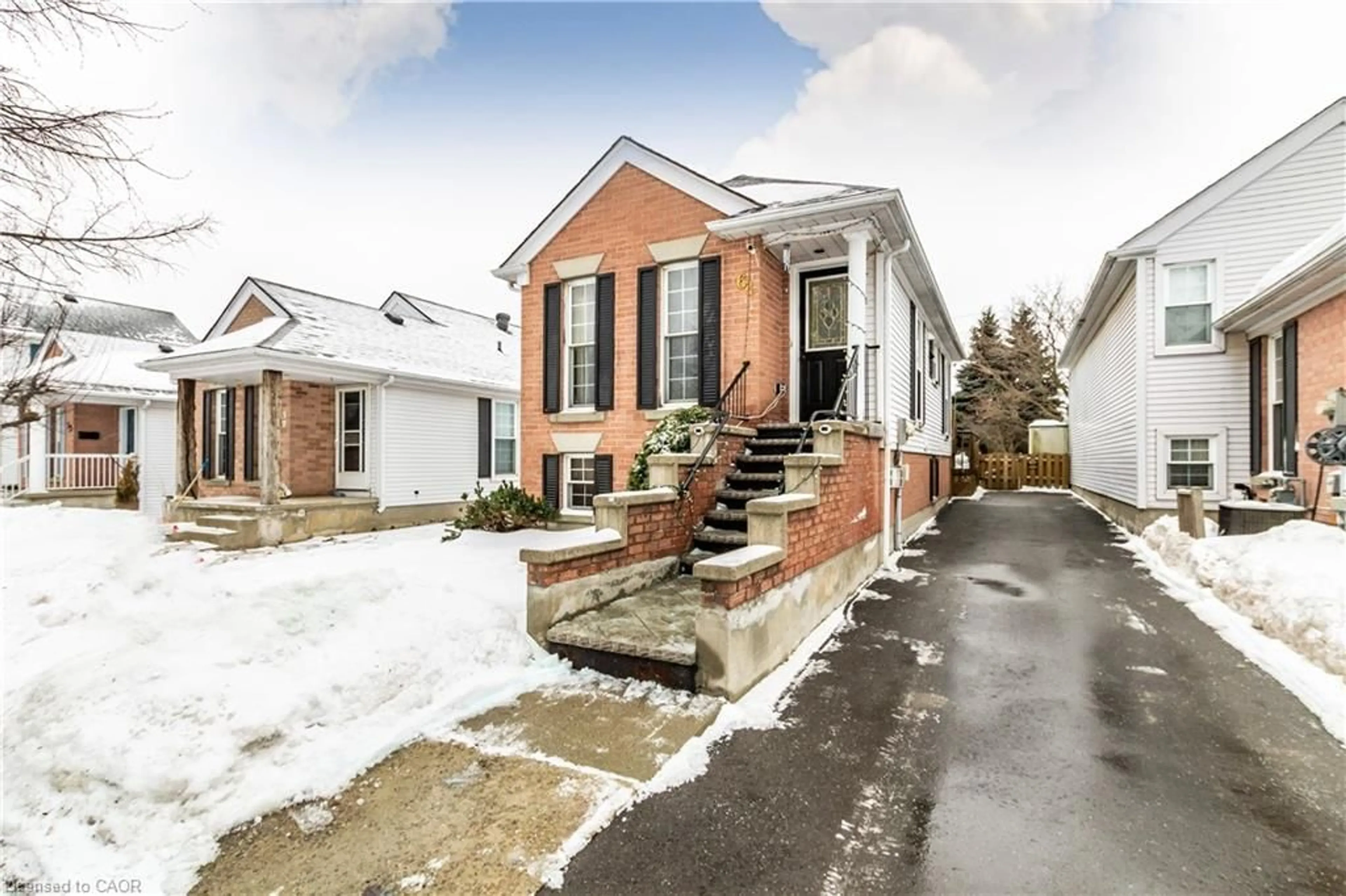 Home with brick exterior material, street for 61 Wake Robin Dr, Kitchener Ontario N2E 3L4