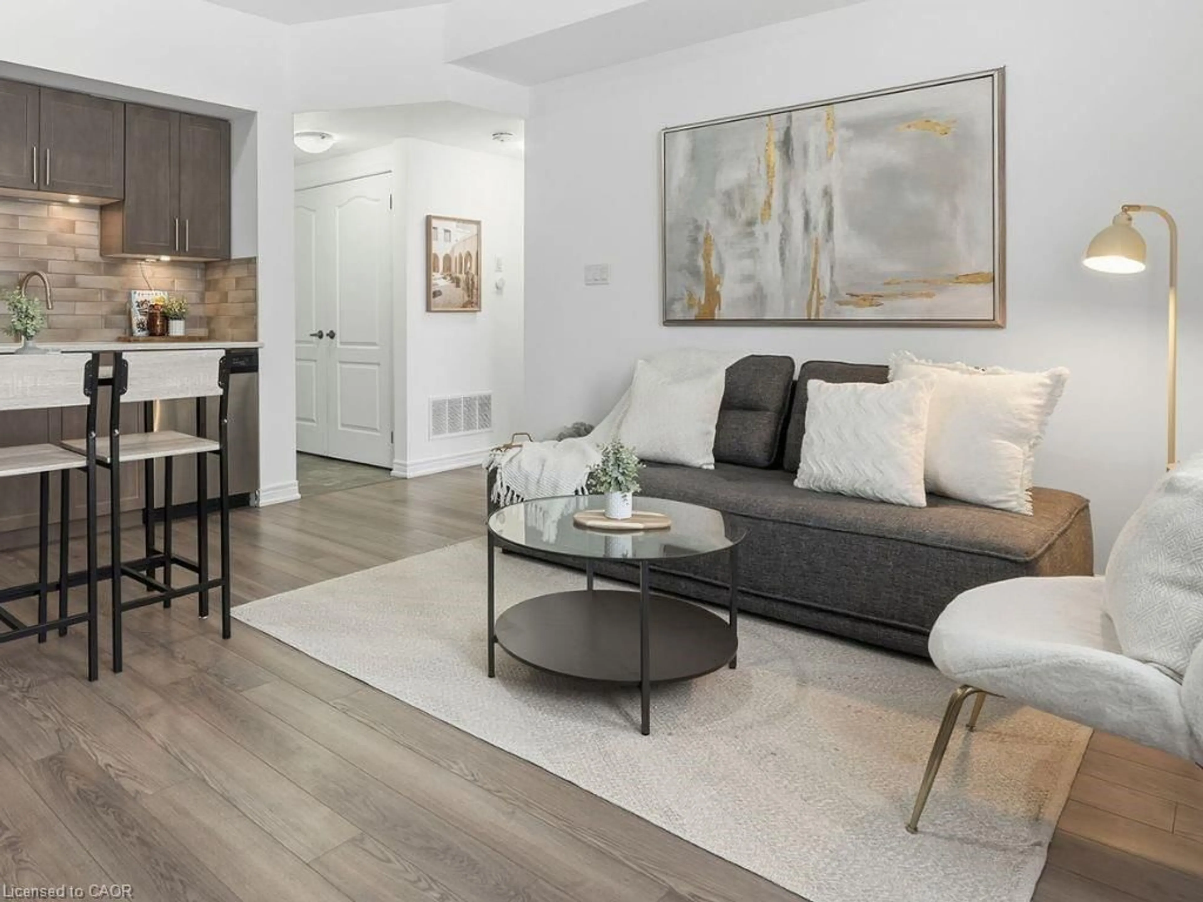 Living room with furniture, wood/laminate floor for 154 Watson Pky, Guelph Ontario N1E 0P6