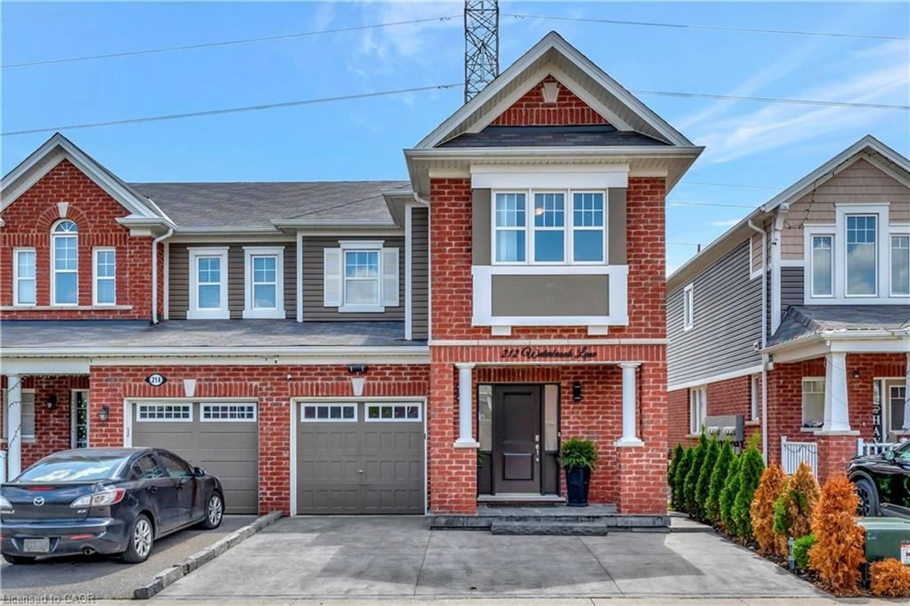 Home with brick exterior material, street for 212 Waterbrook Lane, Kitchener Ontario N2P 0H7