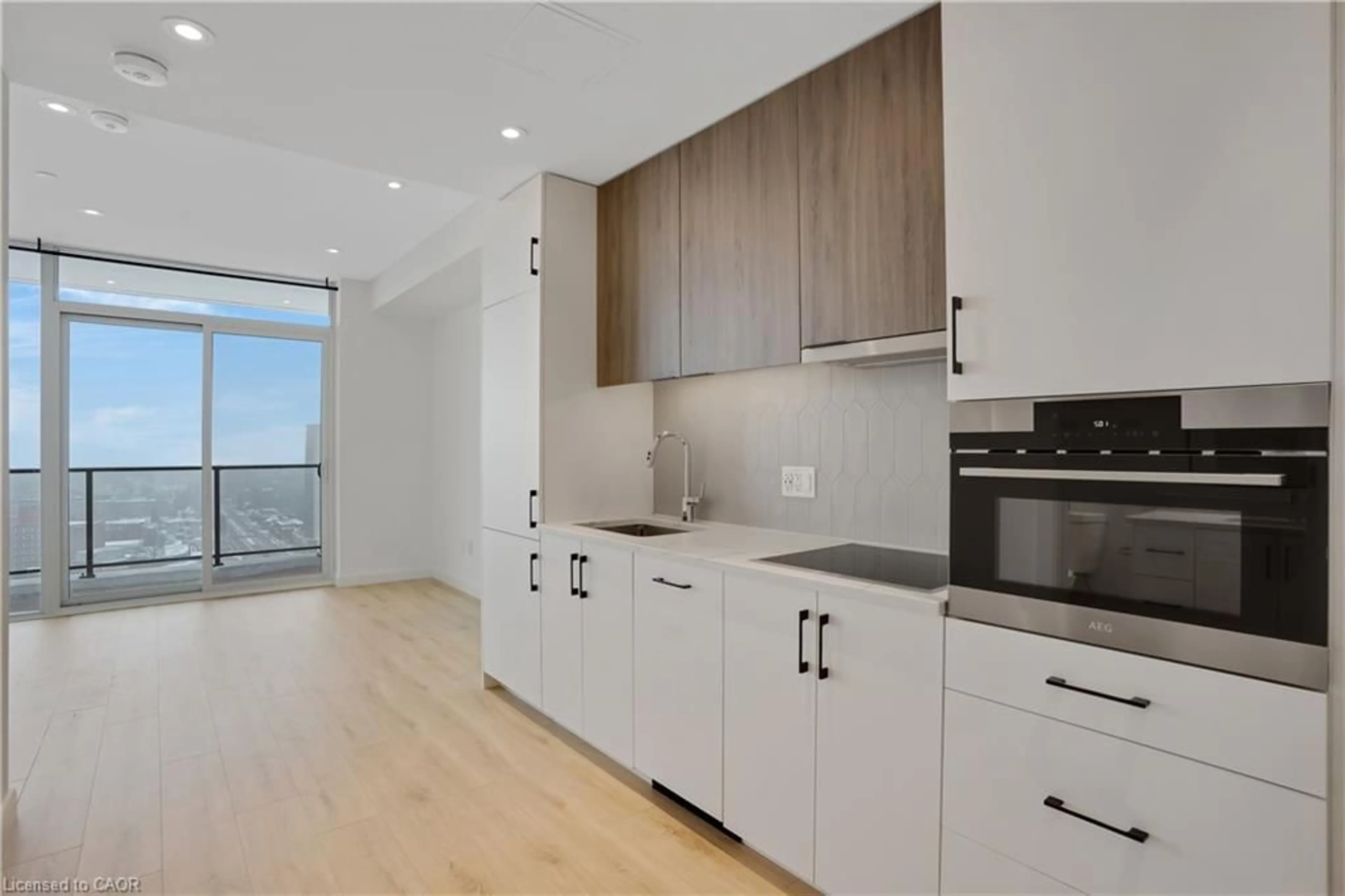 Open concept kitchen, wood/laminate floor for 741 King St #1809, Kitchener Ontario N2G 0E9