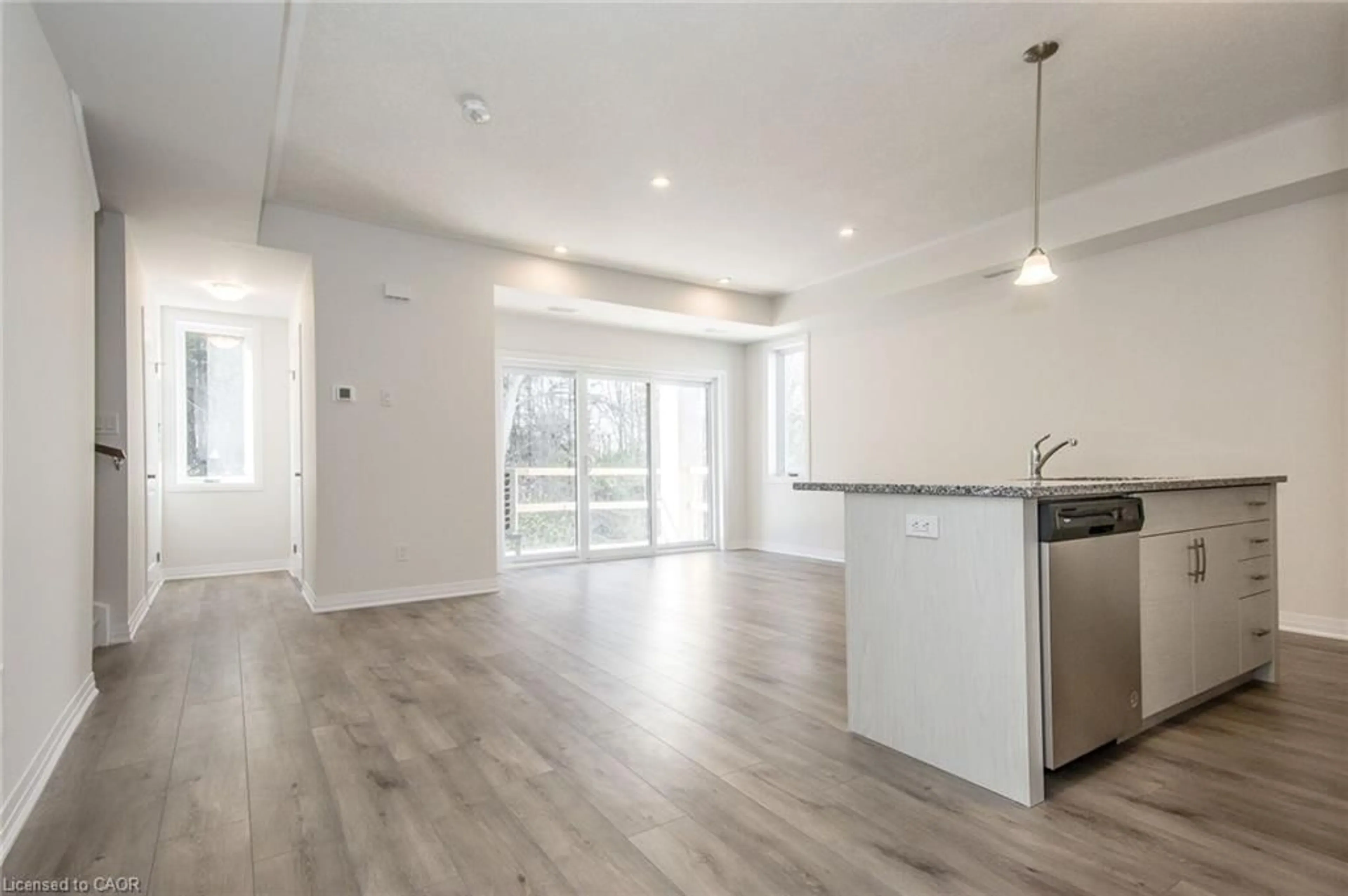 Open concept kitchen, wood/laminate floor for 25 Isherwood Ave #C036, Cambridge Ontario N1R 0E2