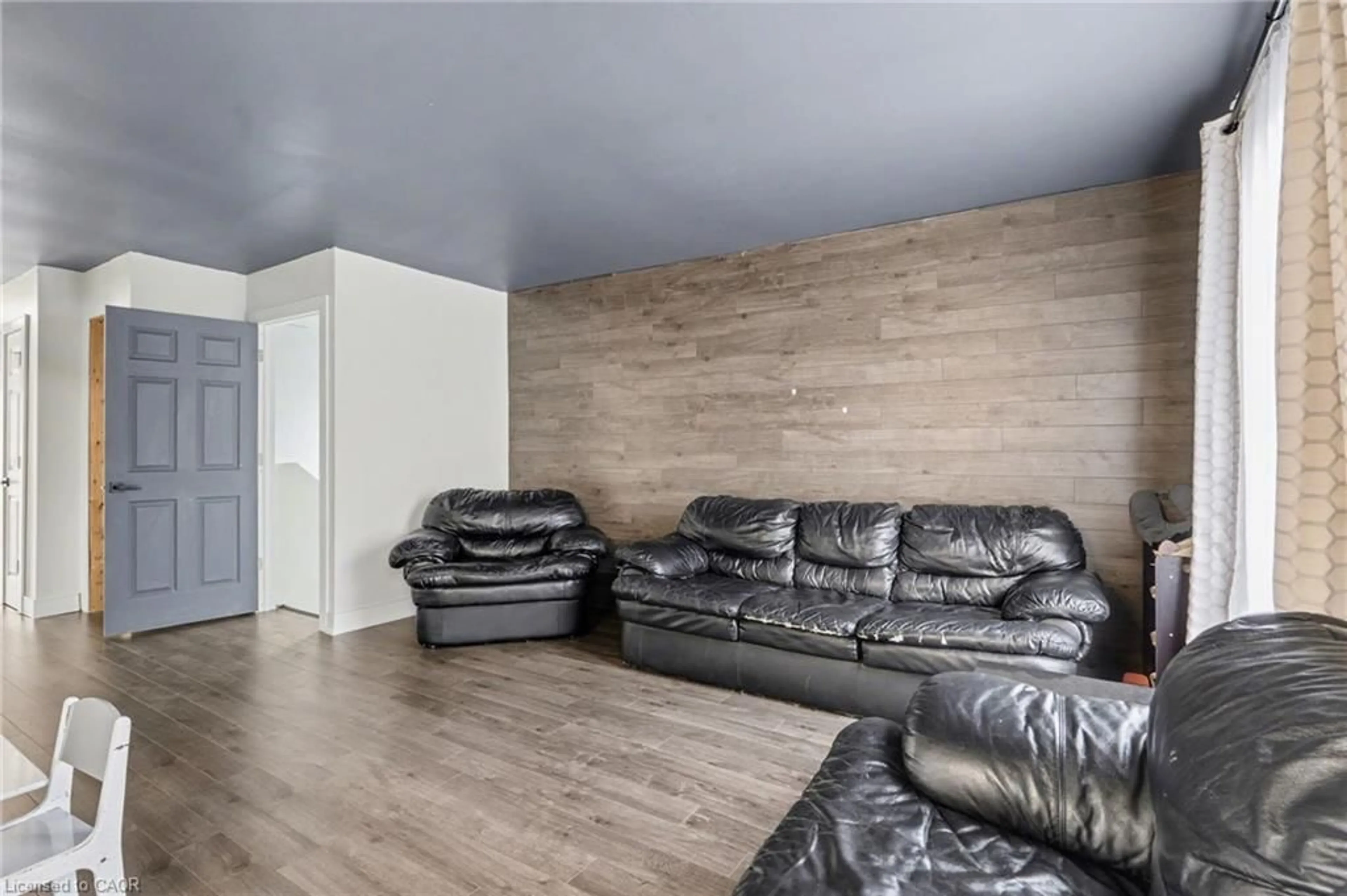 Living room with furniture, wood/laminate floor for 5 Equestrian Crt, Brantford Ontario N3P 1H1