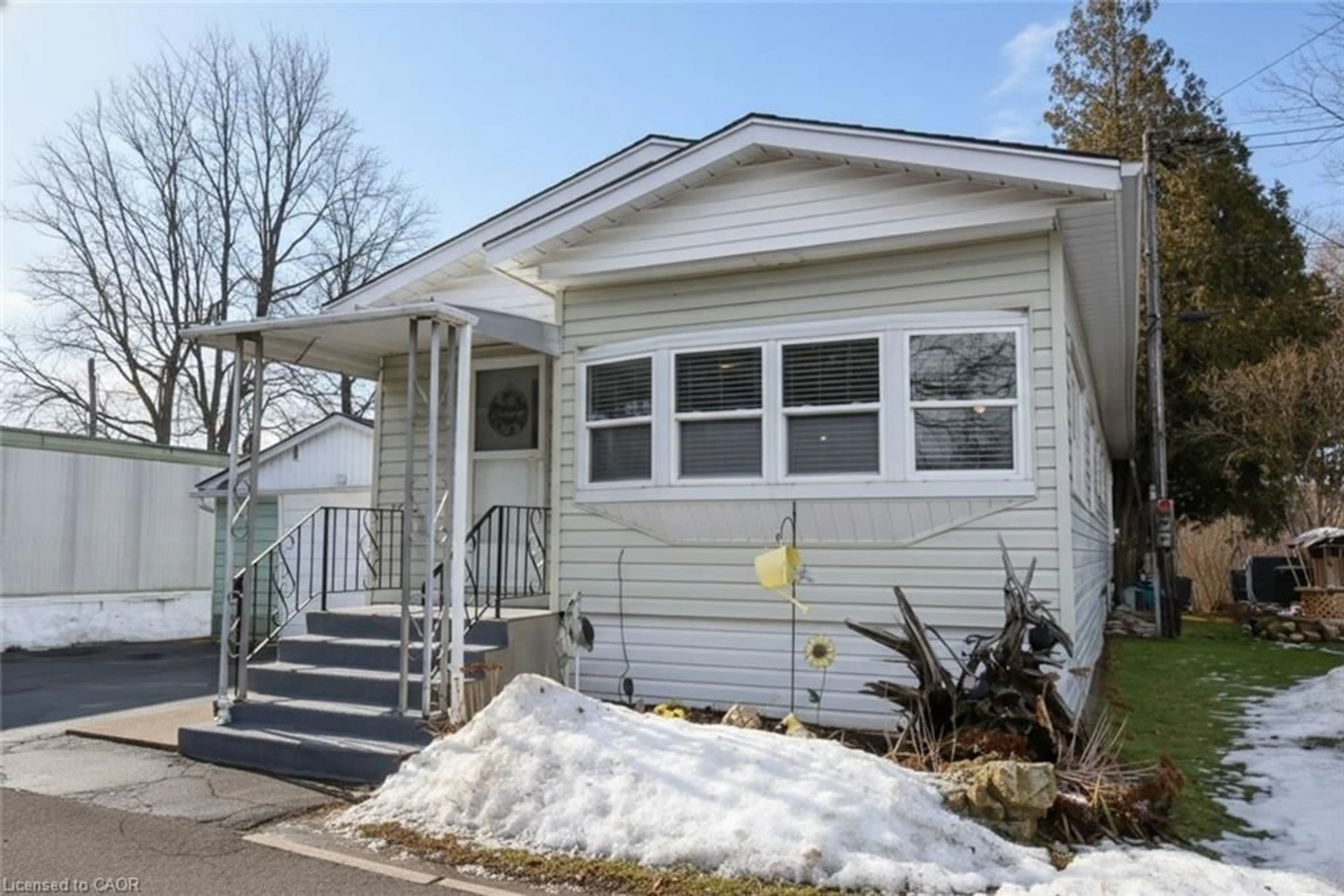 Home with vinyl exterior material, street for 1294 8th Concession Rd #12 MacPherson, Flamborough Ontario N0B 2J0