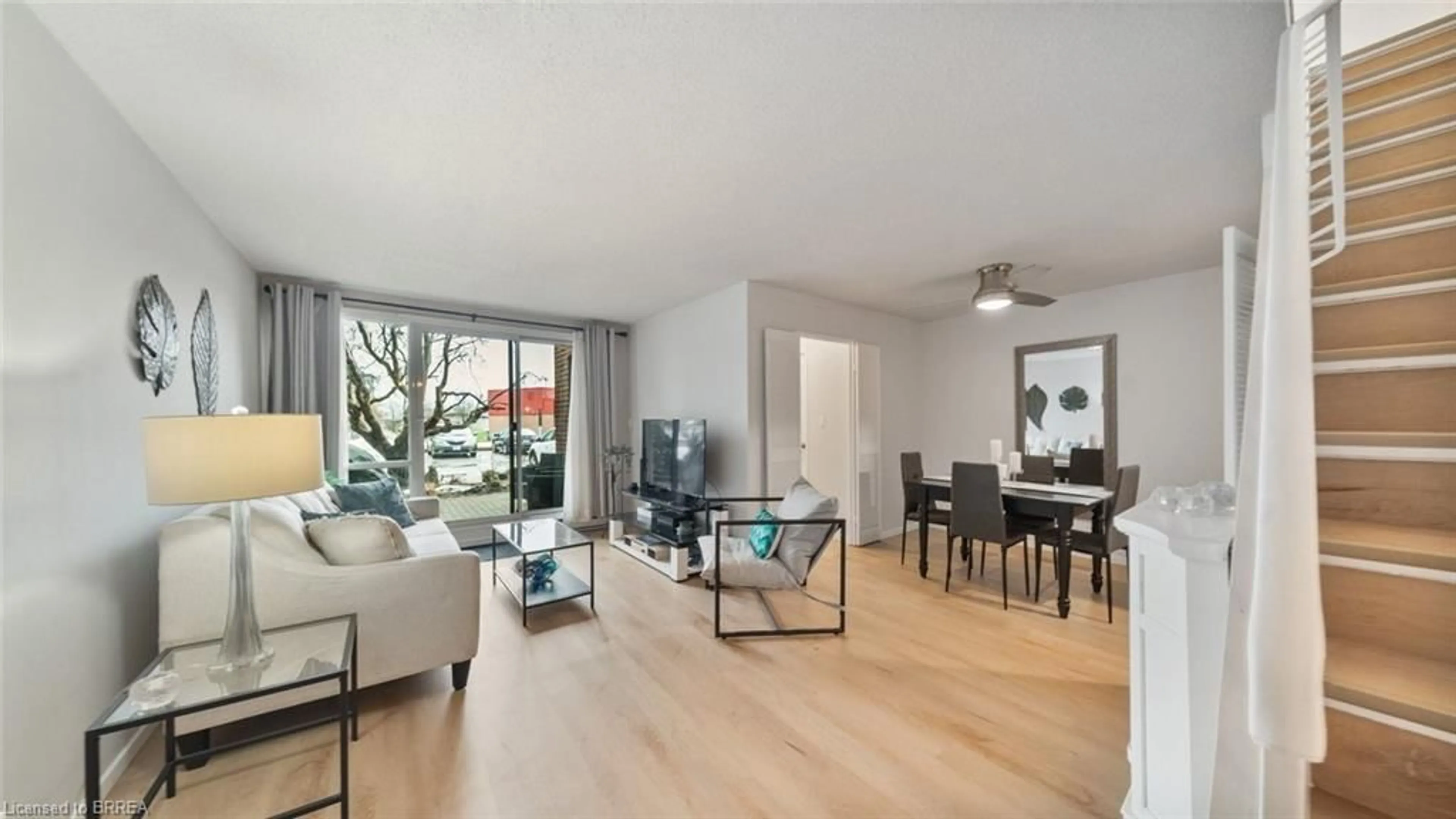 Living room with furniture, wood/laminate floor for 36 Hayhurst Rd #136, Brantford Ontario N3R 6Y9