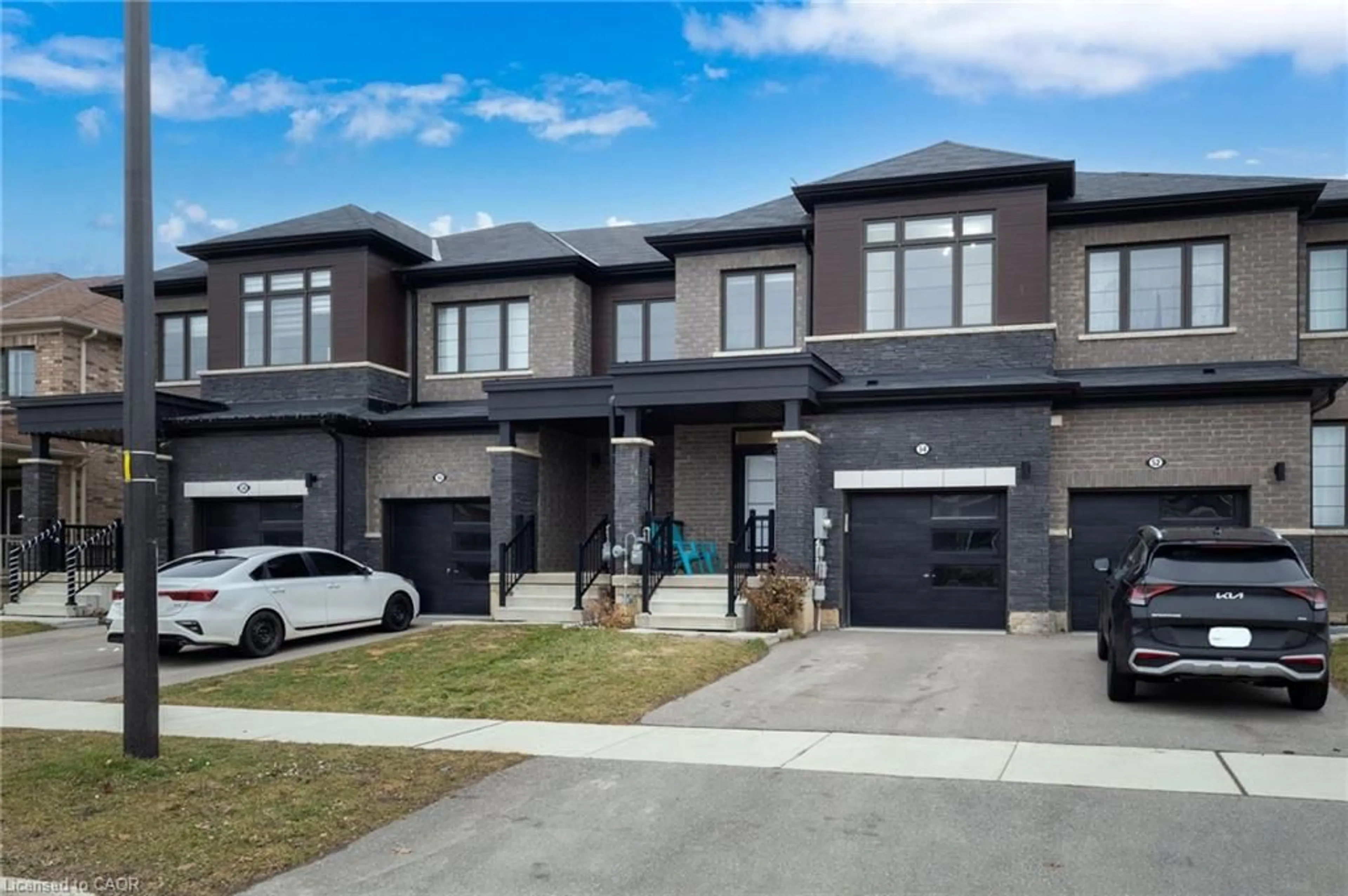 Home with brick exterior material, street for 54 Oaktree Dr, Caledonia Ontario N3W 0E7