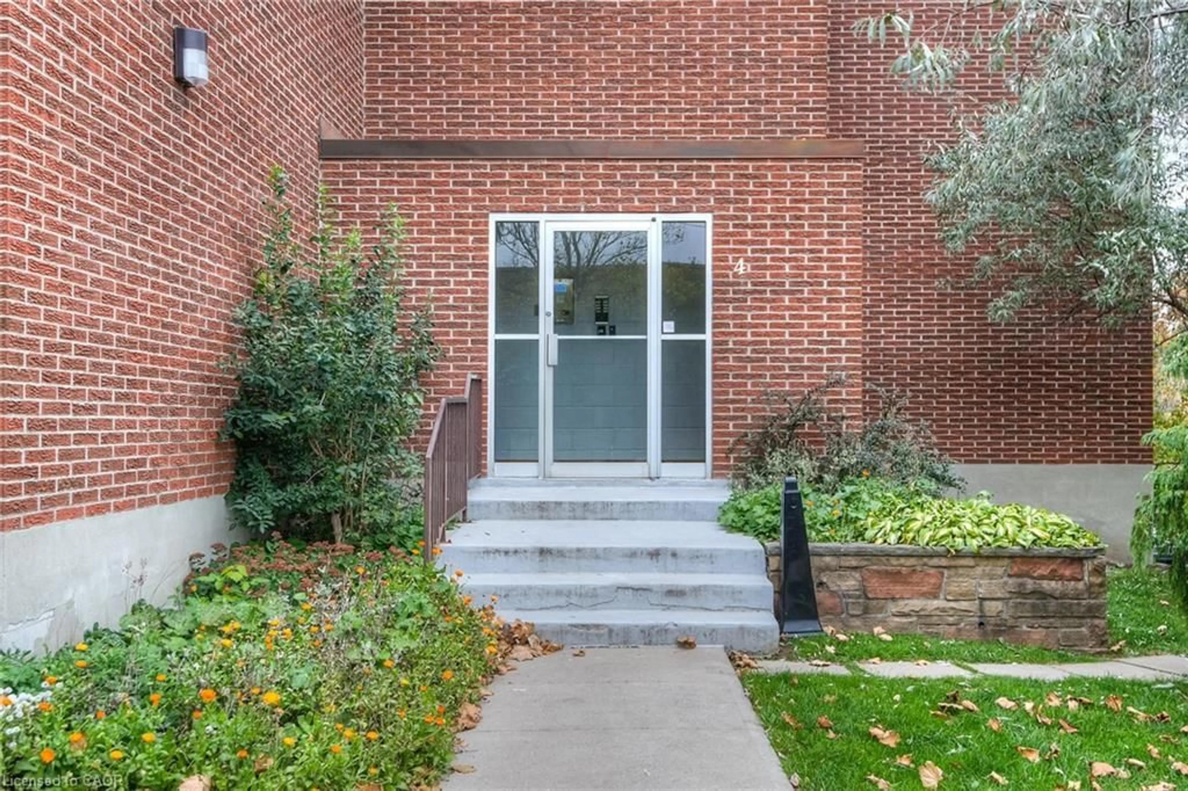 Home with brick exterior material, street for 4 Avalon Pl #103, Kitchener Ontario N2M 4N6