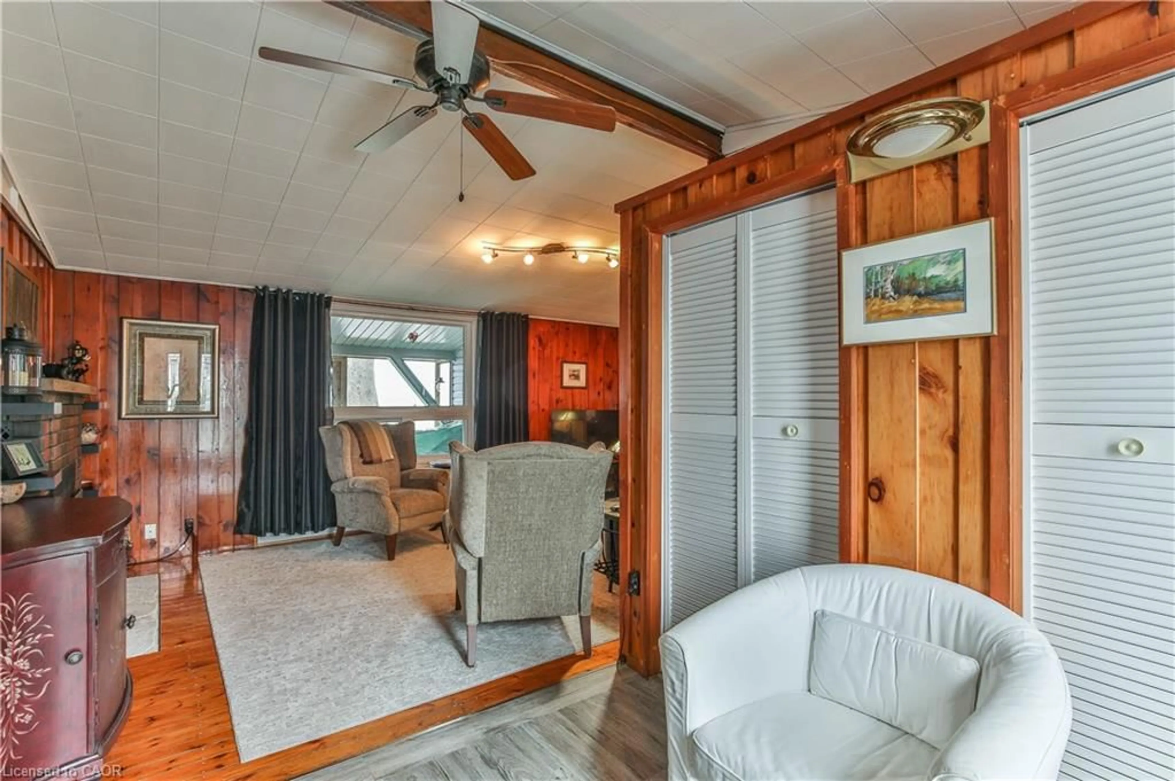 Living room with furniture, wood/laminate floor for 7 Bee St, St. Williams Ontario N0E 1P0