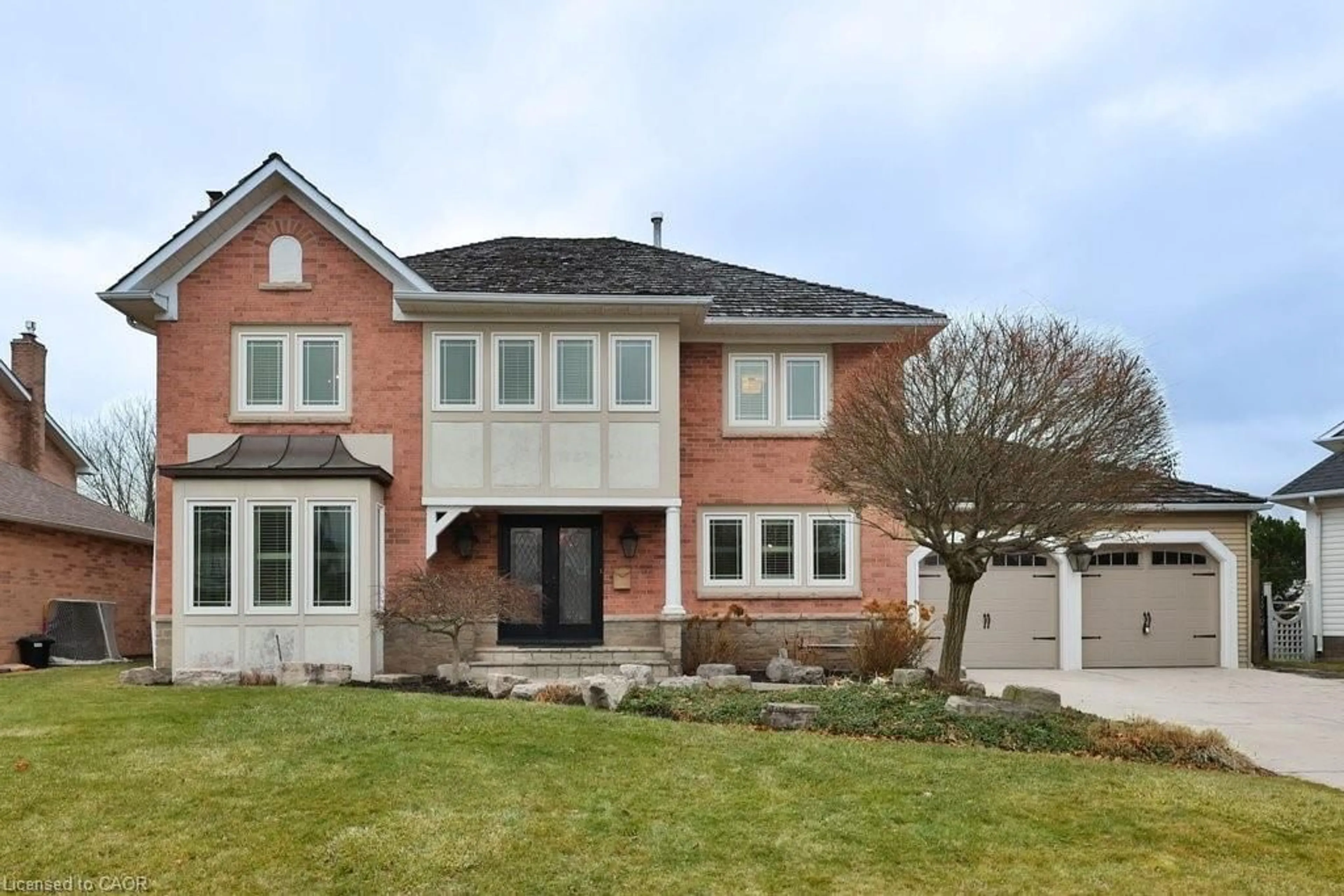 Home with brick exterior material, street for 2047 Country Club Dr, Burlington Ontario L7M 3Z2