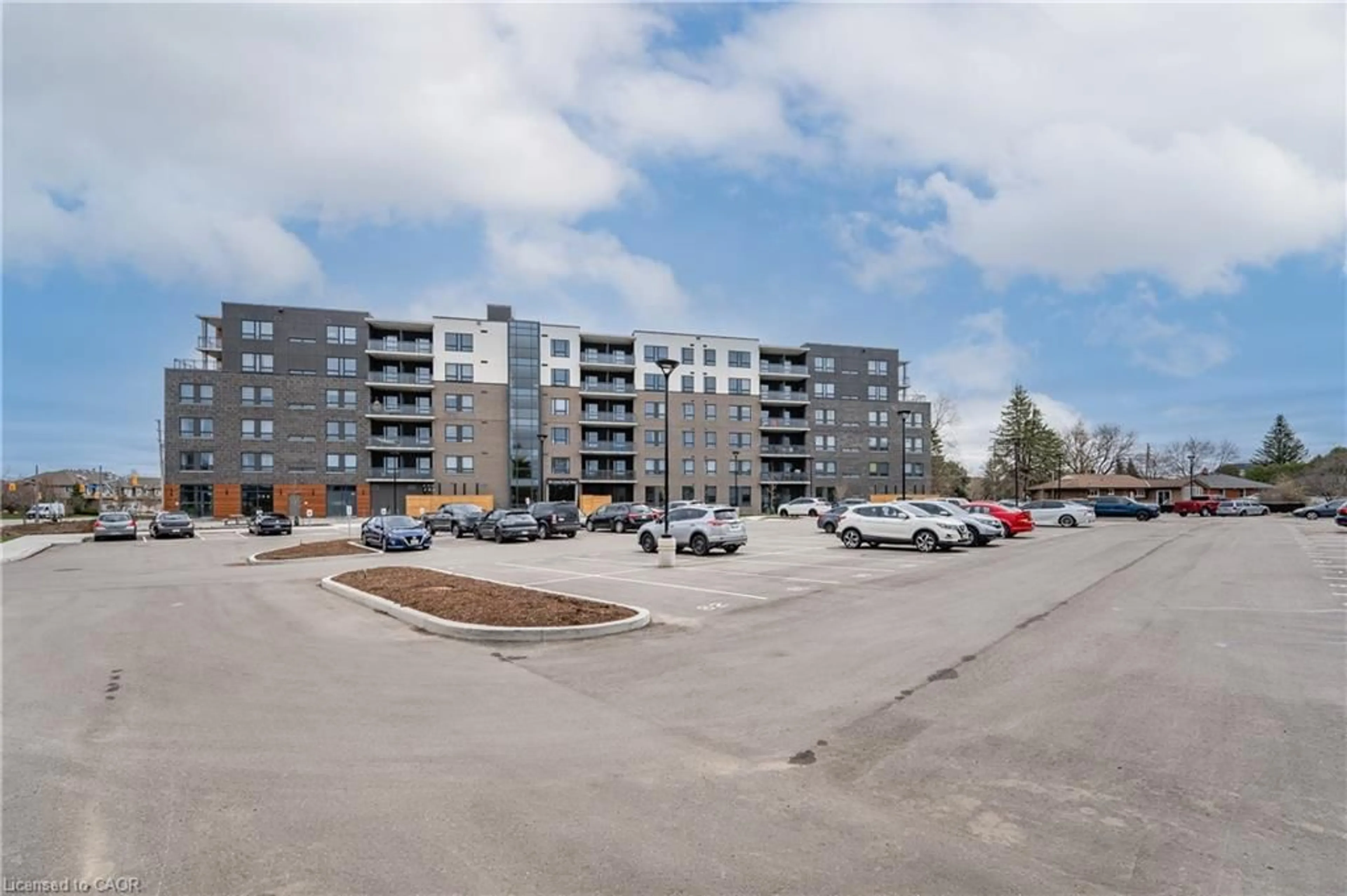 A pic from outside/outdoor area/front of a property/back of a property/a pic from drone, unknown for 26 Lowes Rd #207, Guelph Ontario N1G 4X2