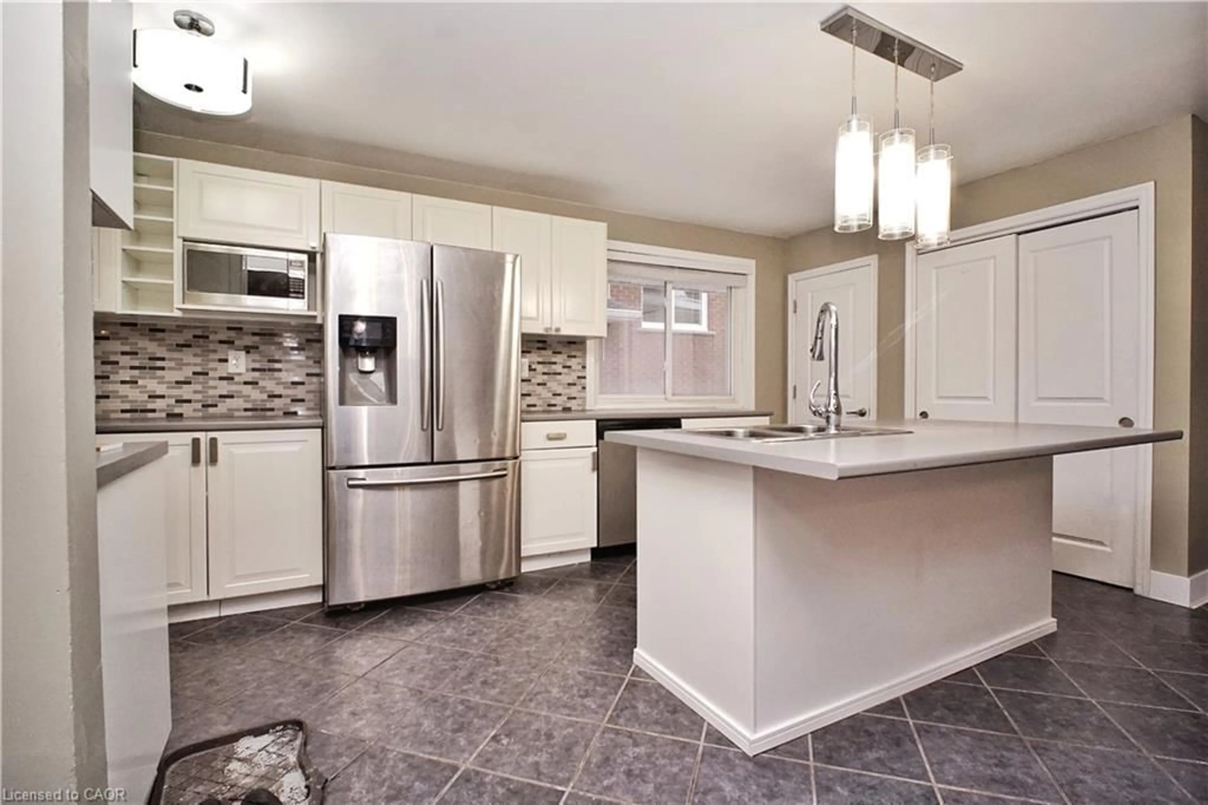 Open concept kitchen, ceramic/tile floor for 61 Bosworth Cres, Kitchener Ontario N2E 1Y9