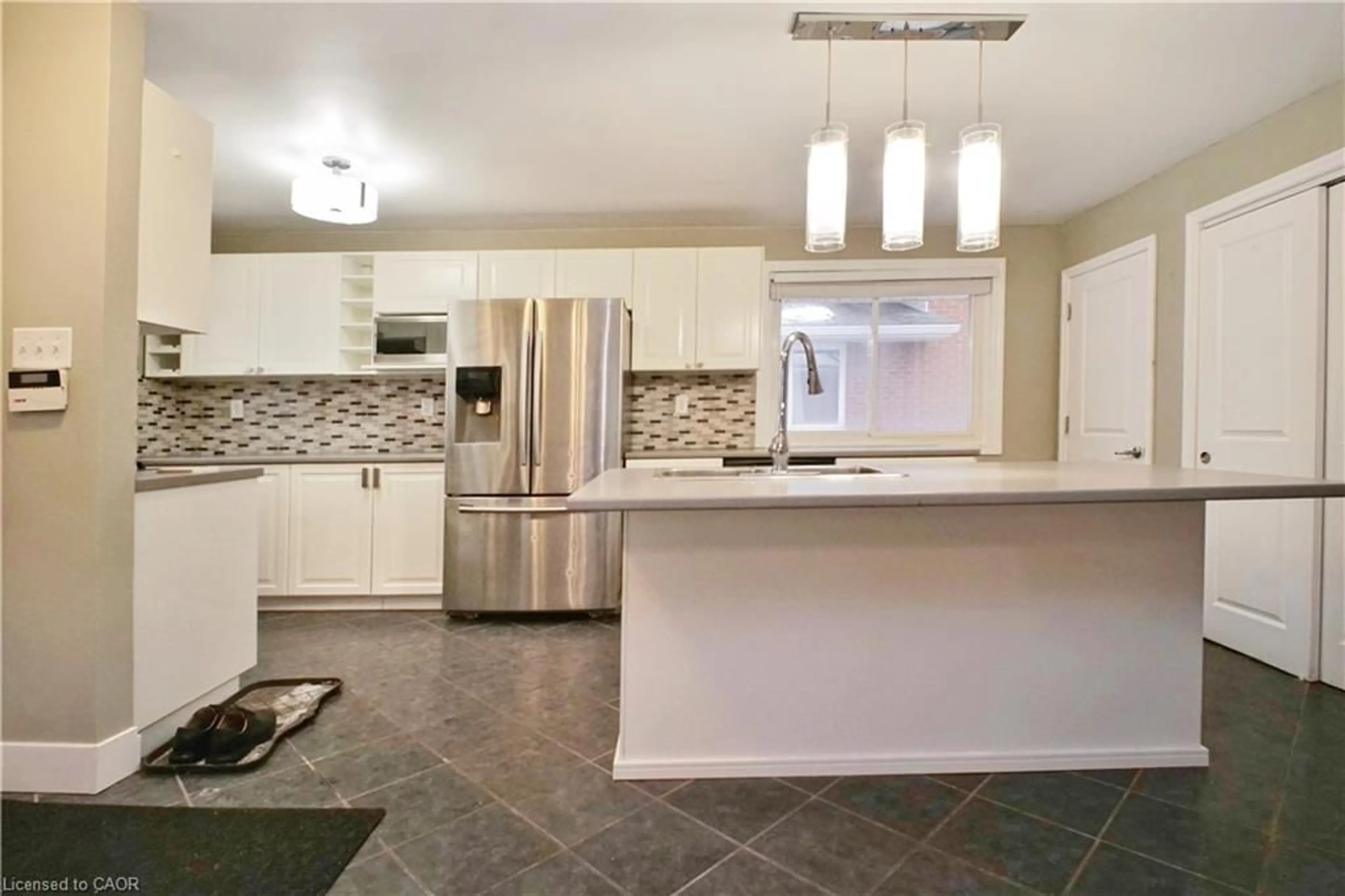 Open concept kitchen, ceramic/tile floor for 61 Bosworth Cres, Kitchener Ontario N2E 1Y9