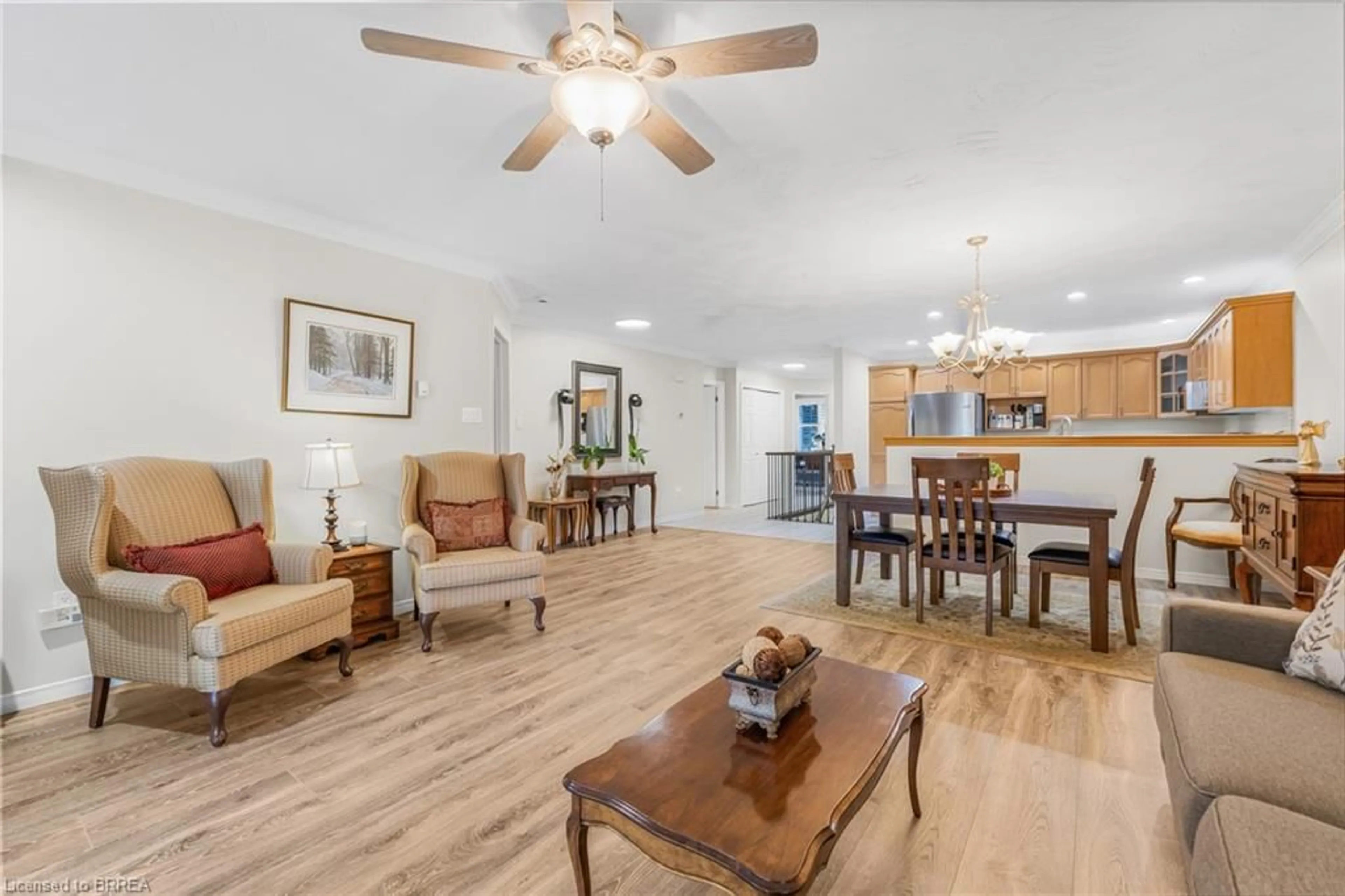 Living room with furniture, wood/laminate floor for 53 Beverly St #21, St. George Ontario N0E 1N0