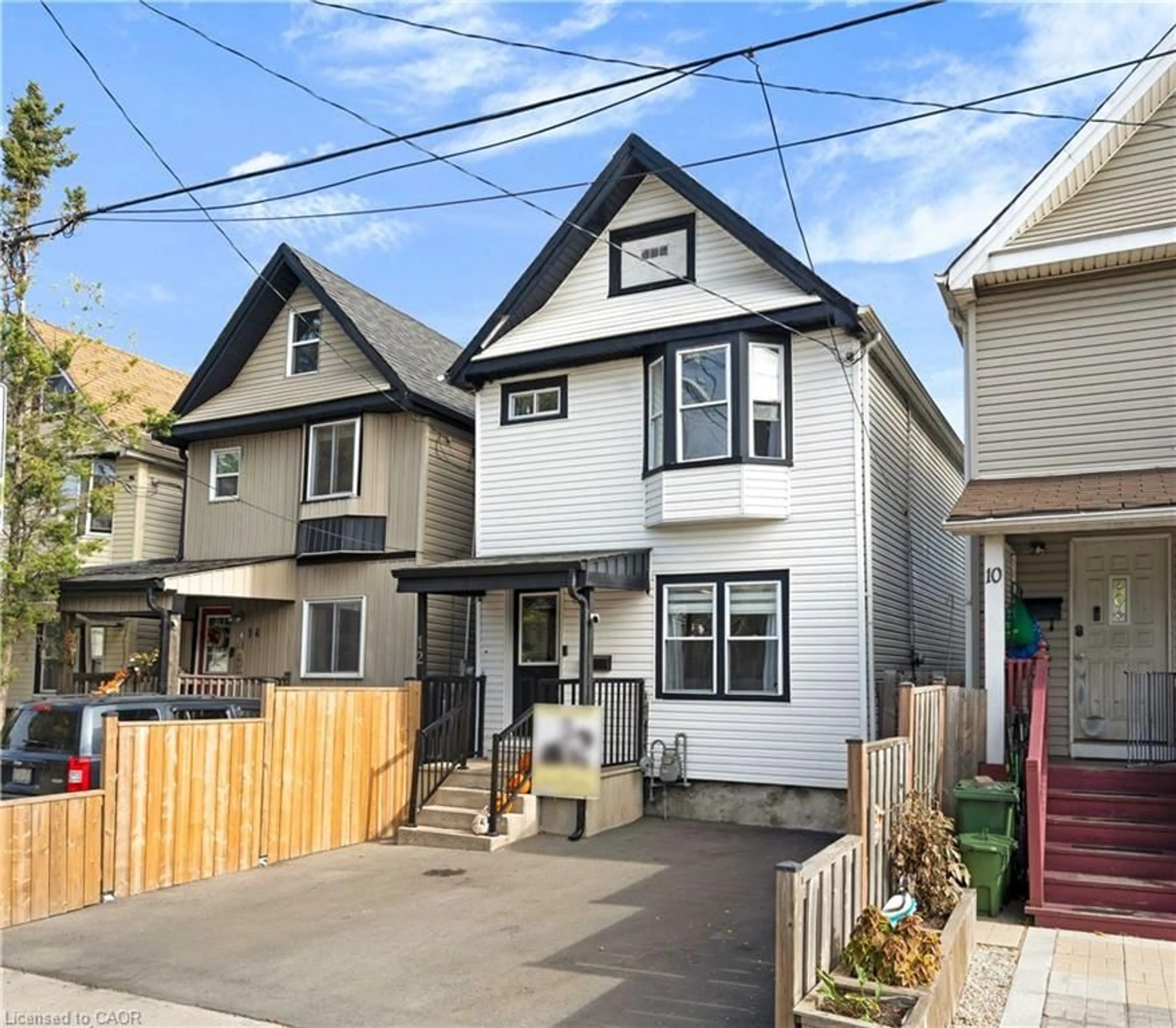 Home with vinyl exterior material, street for 12 Lincoln St, Hamilton Ontario L8L 7L5