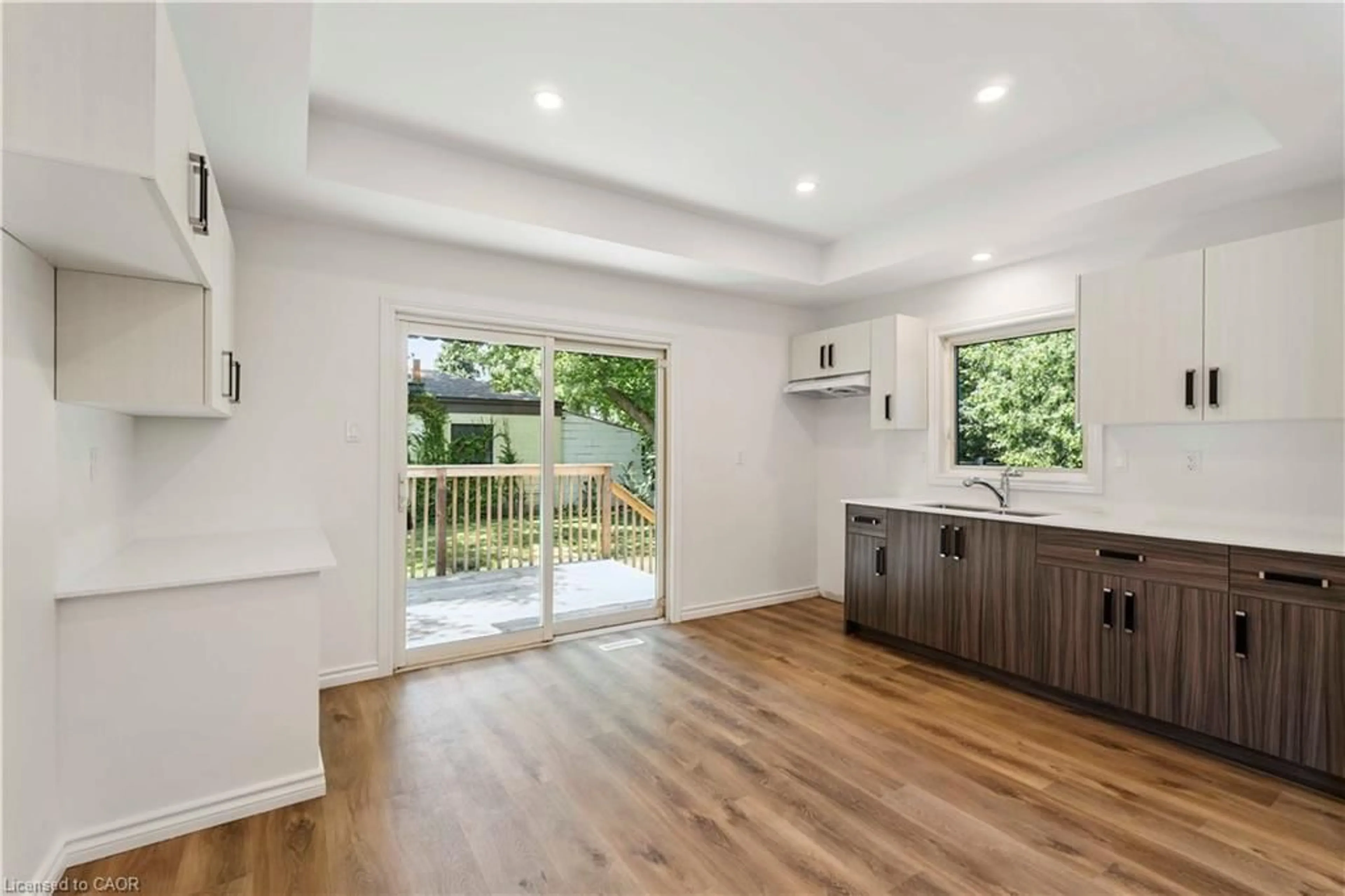 Open concept kitchen, wood/laminate floor for 387 Weir St, Hamilton Ontario L8H 5G6