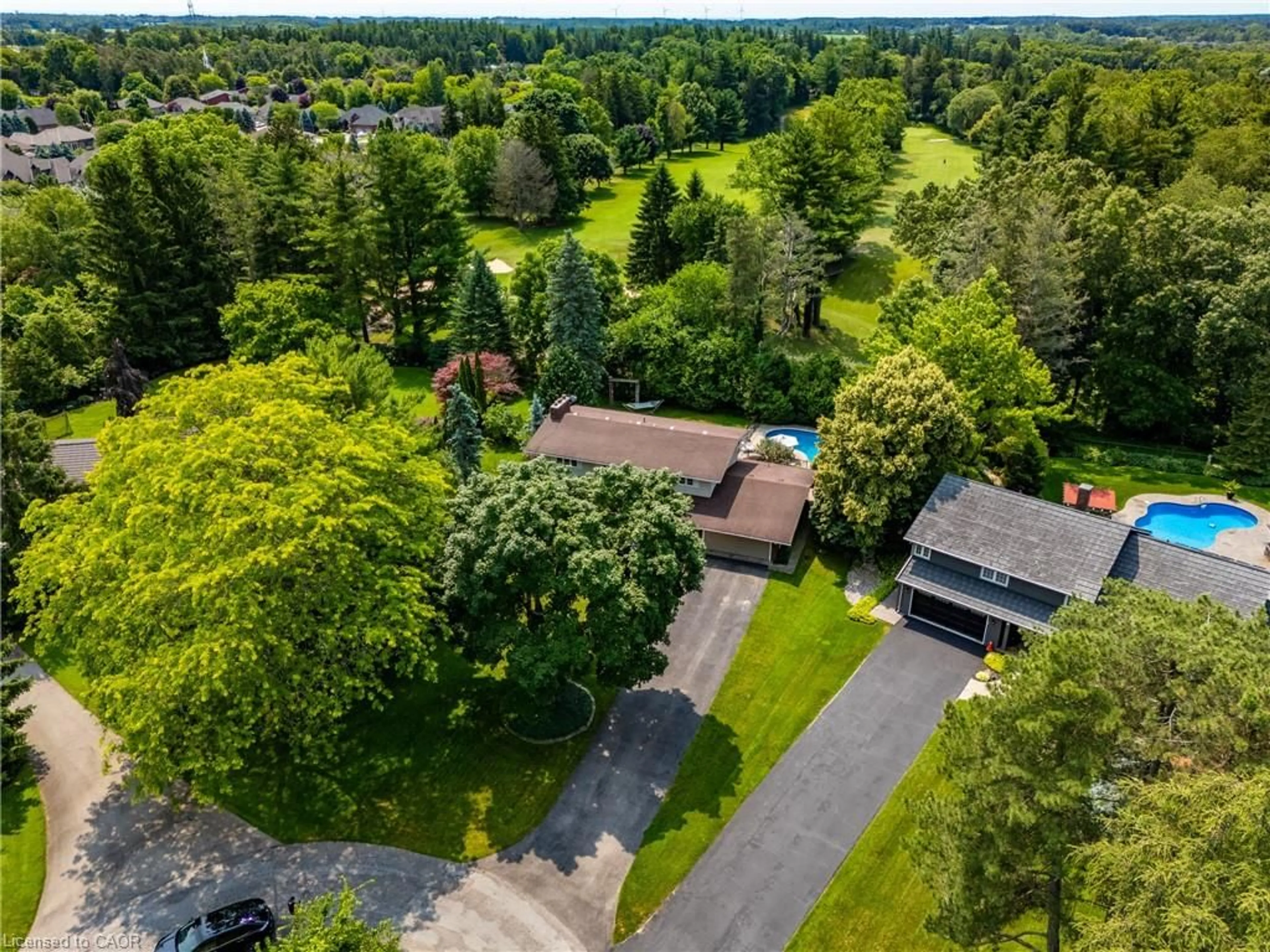 A pic from outside/outdoor area/front of a property/back of a property/a pic from drone, forest/trees view for 6 Summit Cir, Simcoe Ontario N3Y 3K8