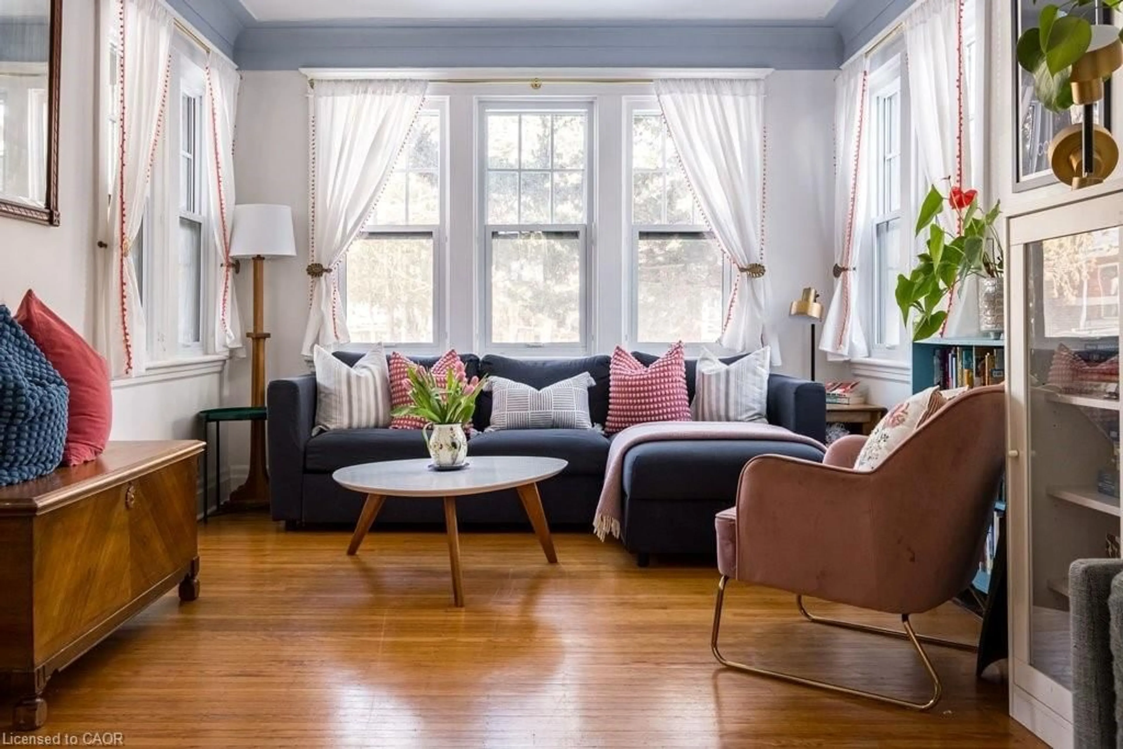 Living room with furniture, wood/laminate floor for 44 Cline Ave, Hamilton Ontario L8S 3Z4