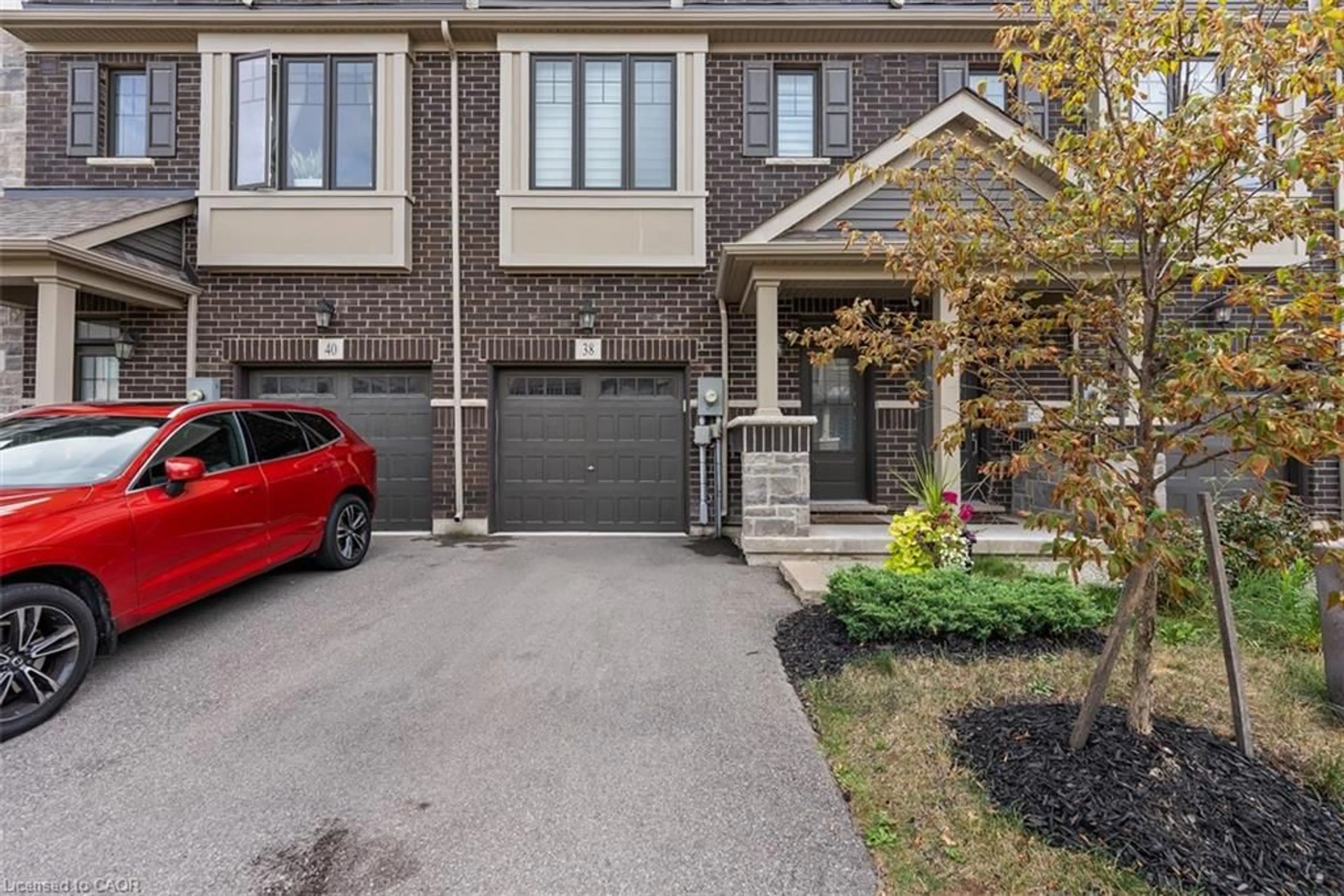 Home with brick exterior material, street for 38 Hibiscus Lane, Hamilton Ontario L8K 0A4