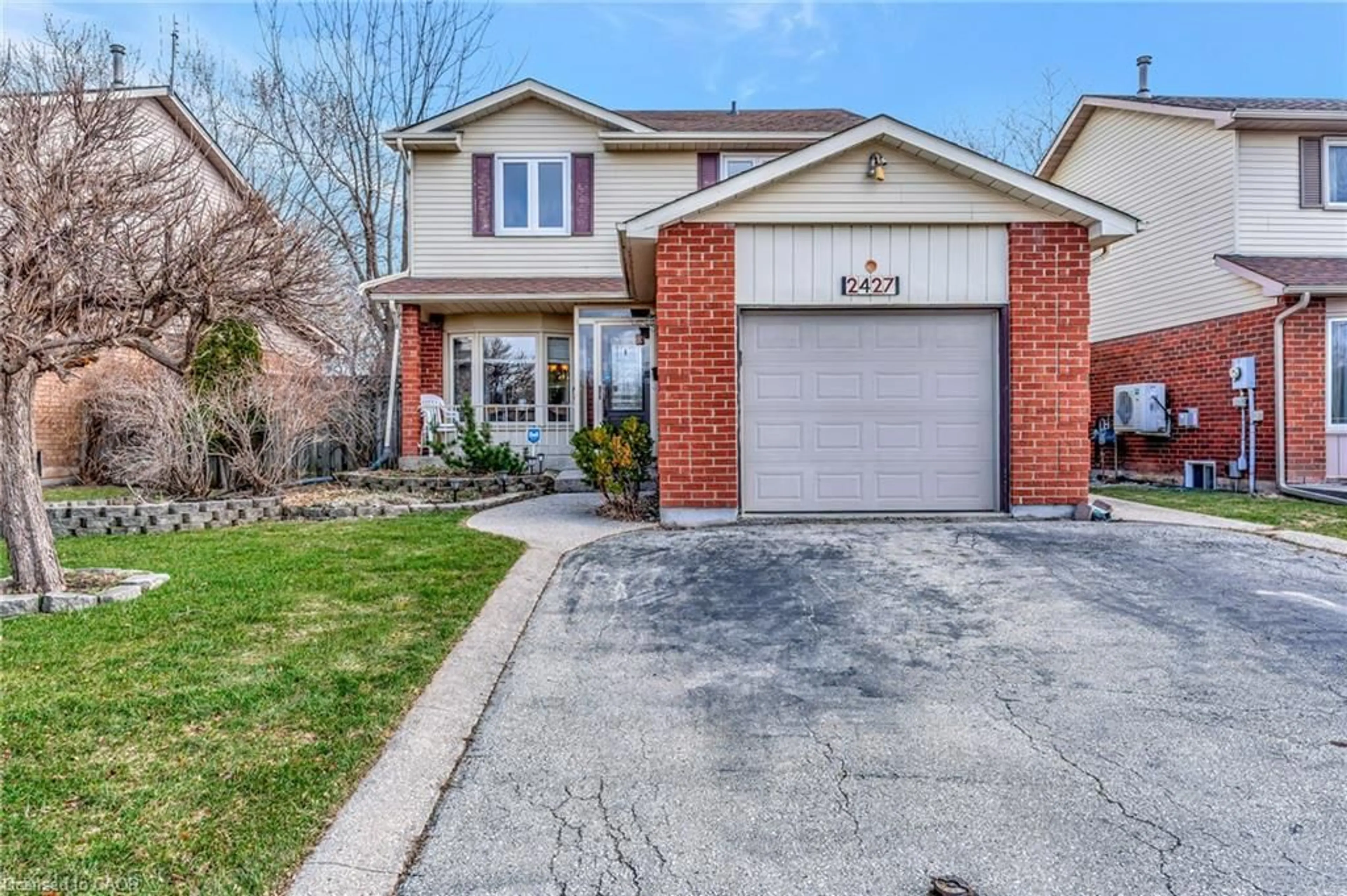 Home with brick exterior material, street for 2427 Headon Forest Dr, Burlington Ontario L7M 3K7