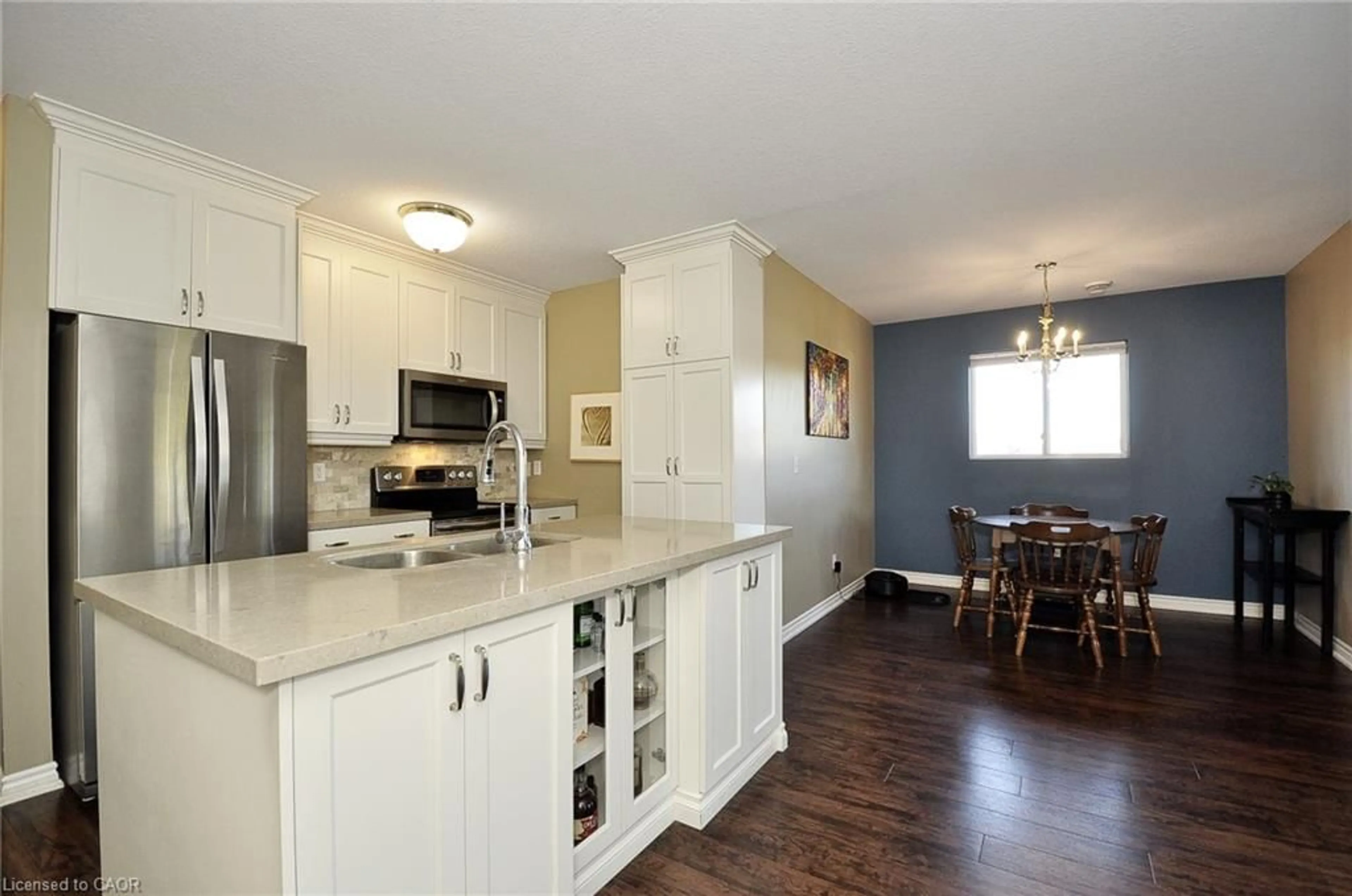Open concept kitchen, wood/laminate floor for 345 Briarmeadow Dr #302, Kitchener Ontario N2A 4J6