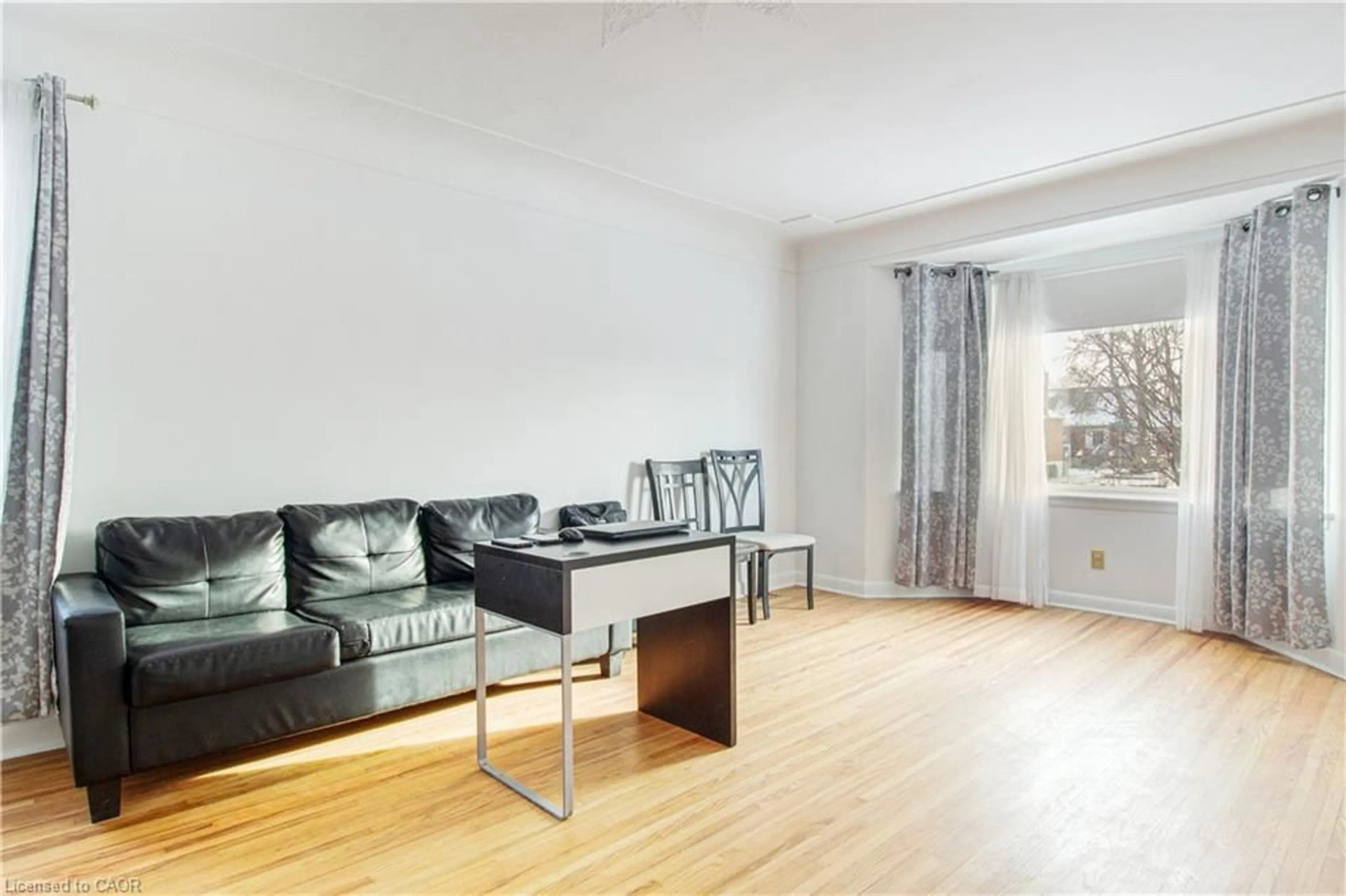 Living room with furniture, wood/laminate floor for 773 Queensdale Ave, Hamilton Ontario L8V 1M7