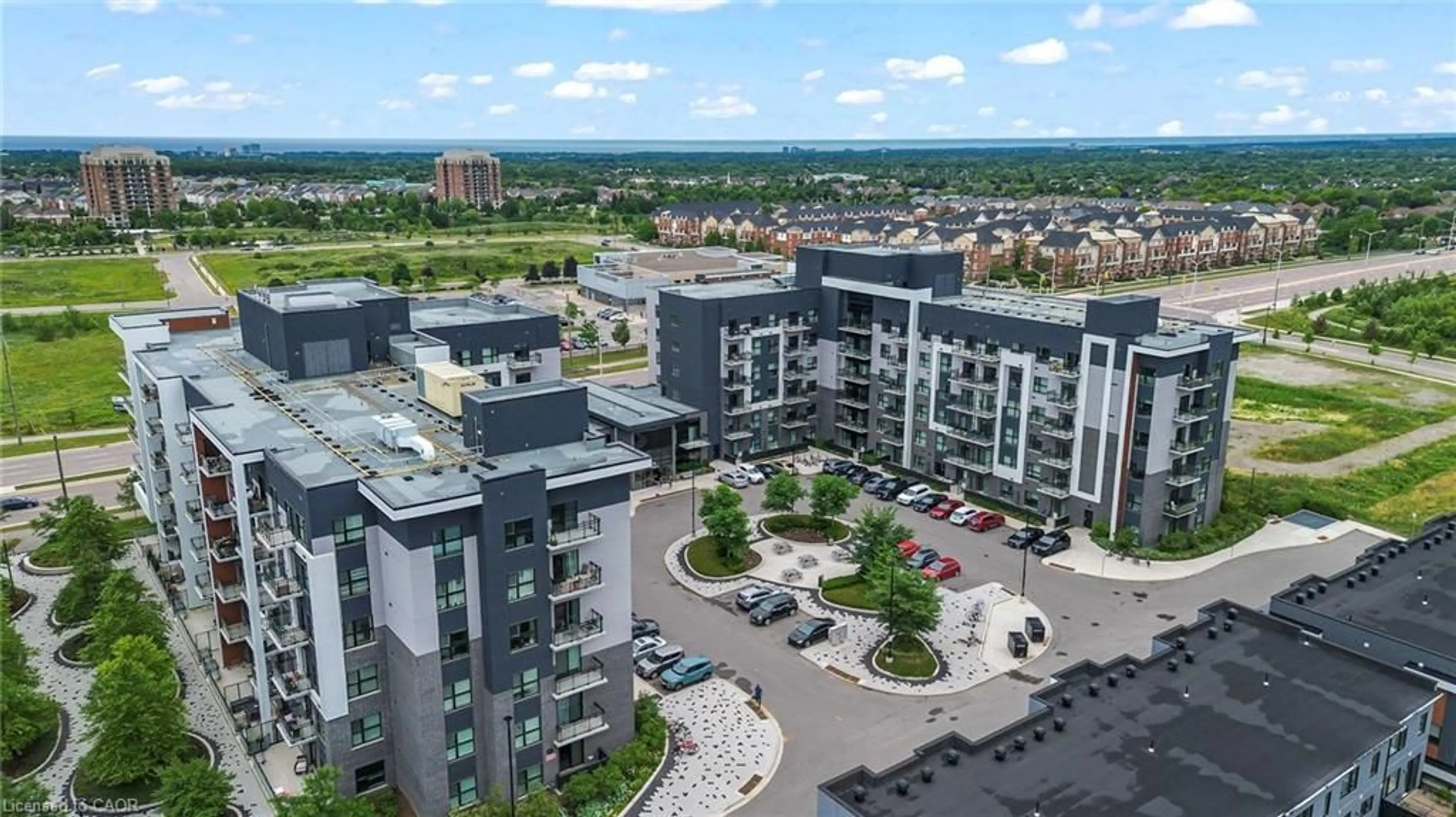 A pic from outside/outdoor area/front of a property/back of a property/a pic from drone, city buildings view from balcony for 102 Grovewood Common #121, Oakville Ontario L6H 0X2