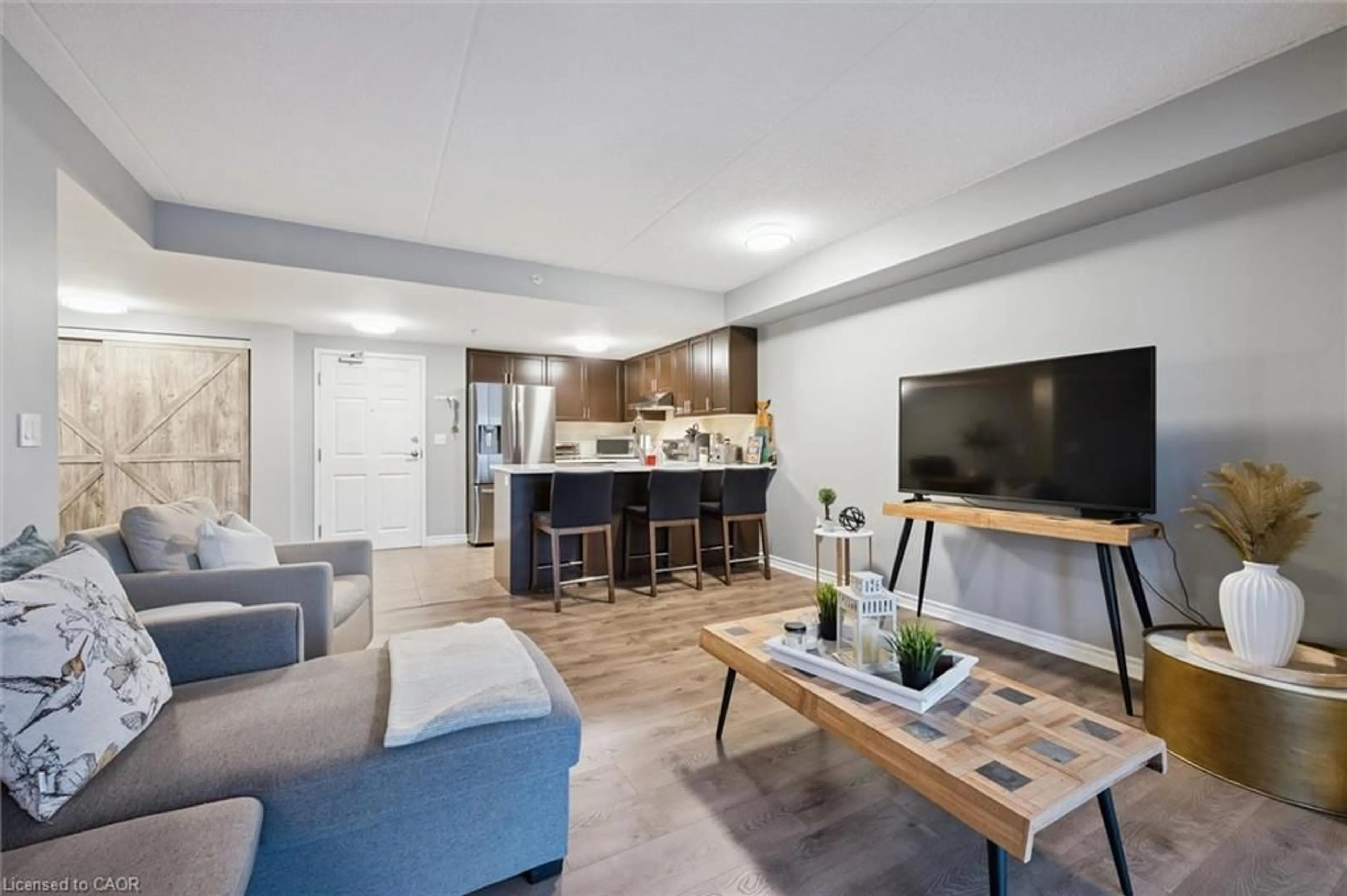 Living room with furniture, unknown for 19 Waterford Dr #109, Guelph Ontario N1L 0G8