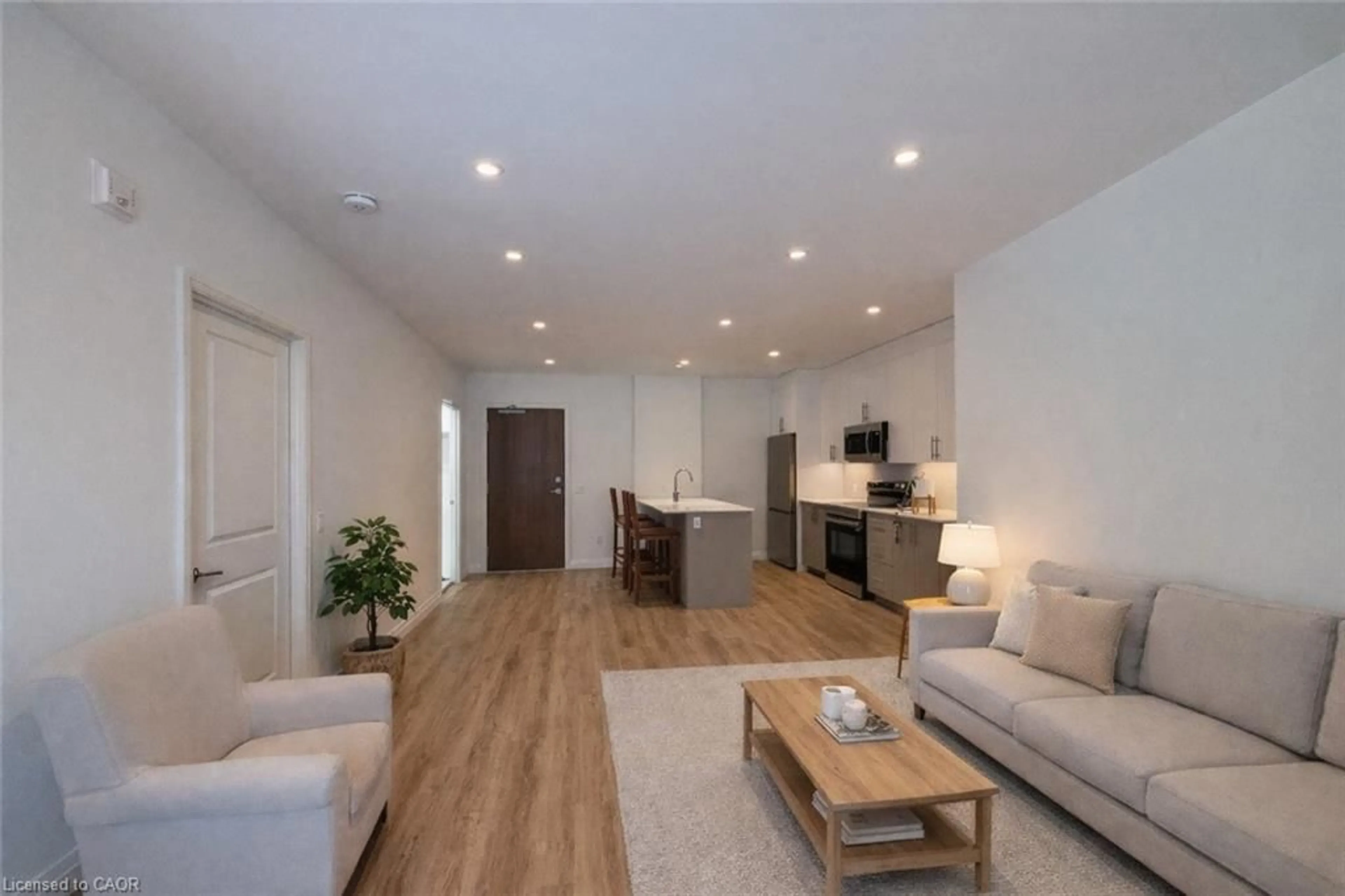 Living room with furniture, wood/laminate floor for 525 New Dundee Rd #225, Kitchener Ontario N2P 0K8