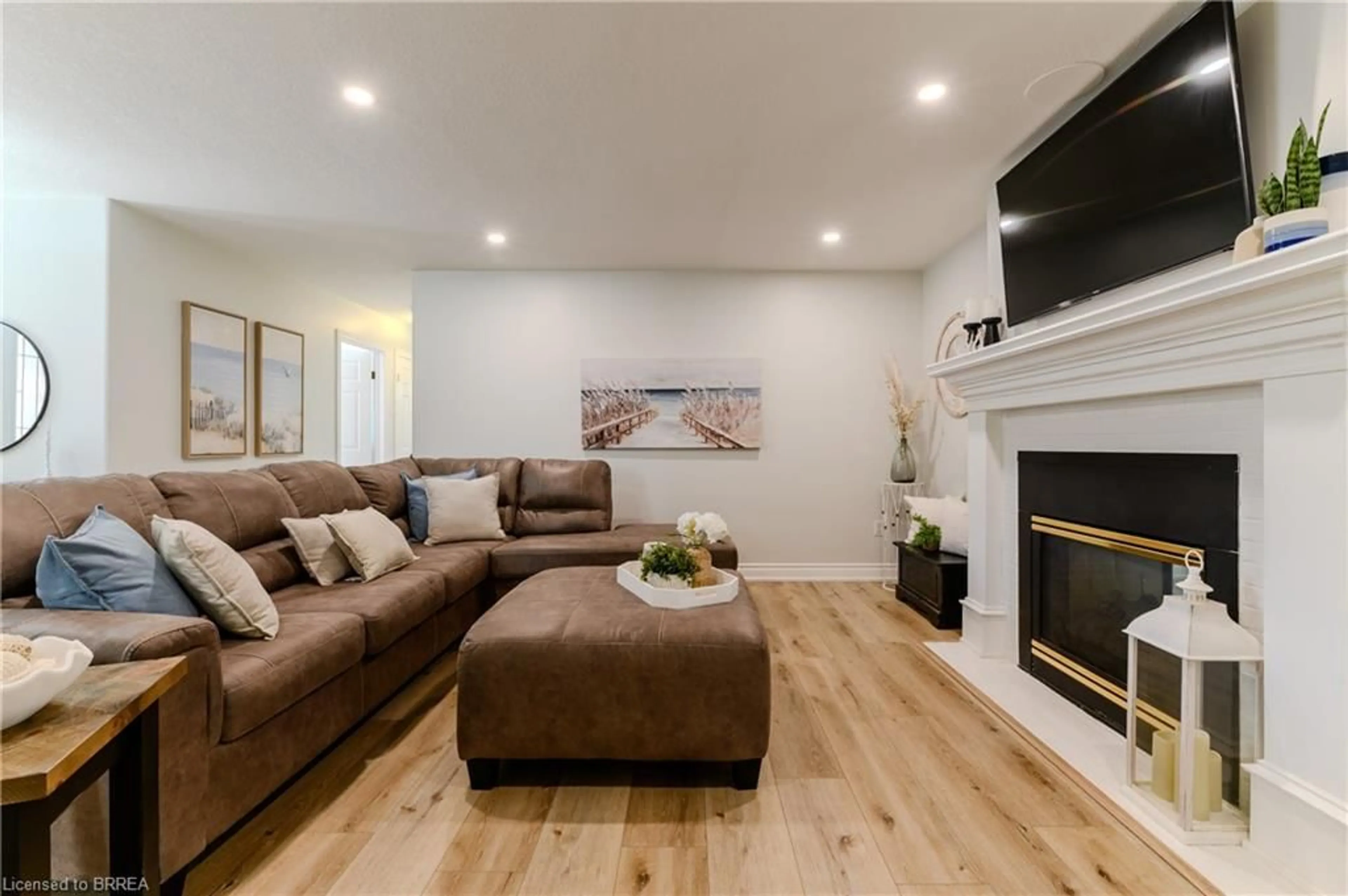 Living room with furniture, wood/laminate floor for 5 Newport Lane, Port Dover Ontario N0A 1N7