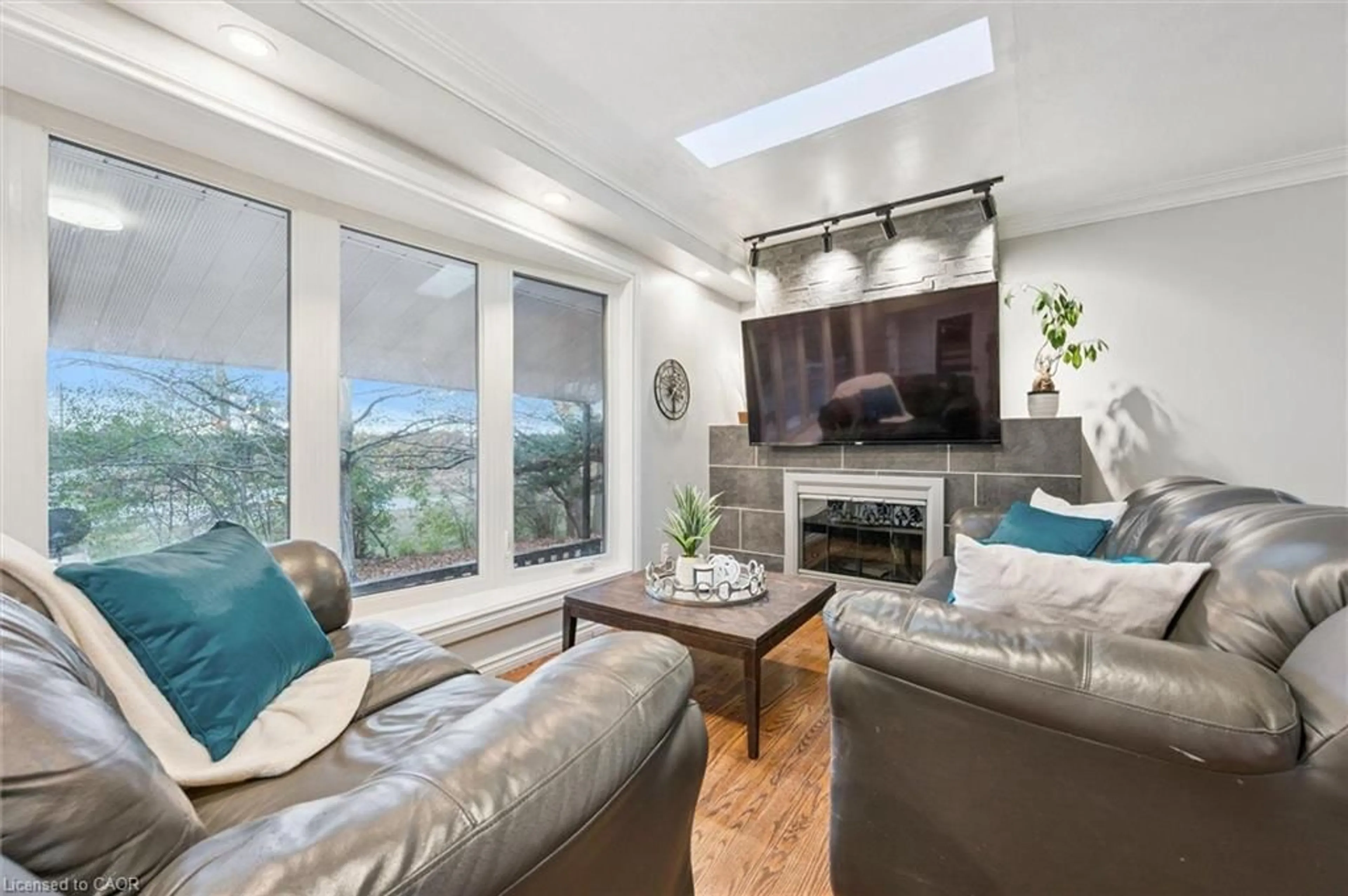 Living room with furniture, wood/laminate floor for 500 Watson Pky, Guelph Ontario N1L 0N9