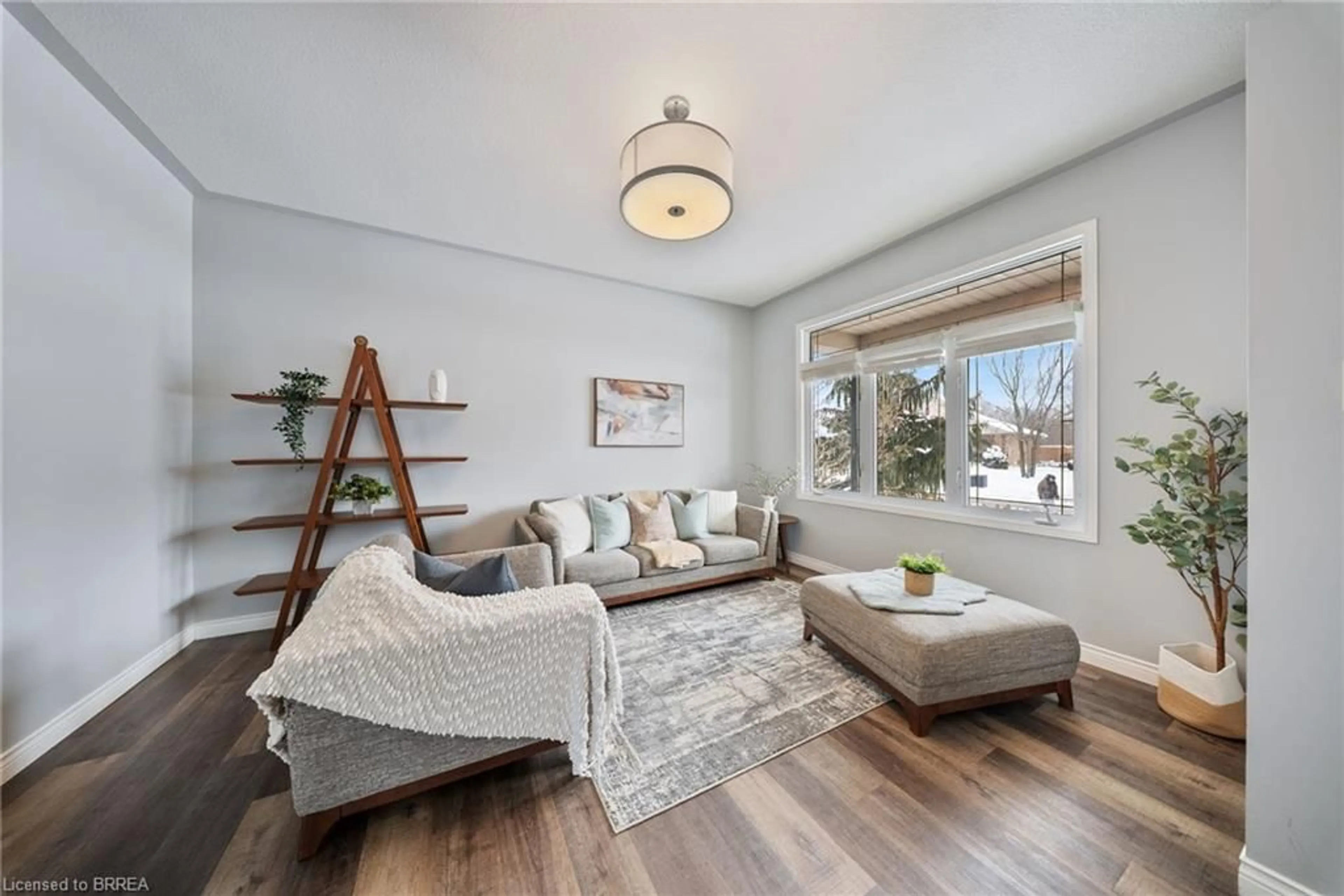 Living room with furniture, wood/laminate floor for 20 Bramble Cres, Townsend Ontario N0A 1S0