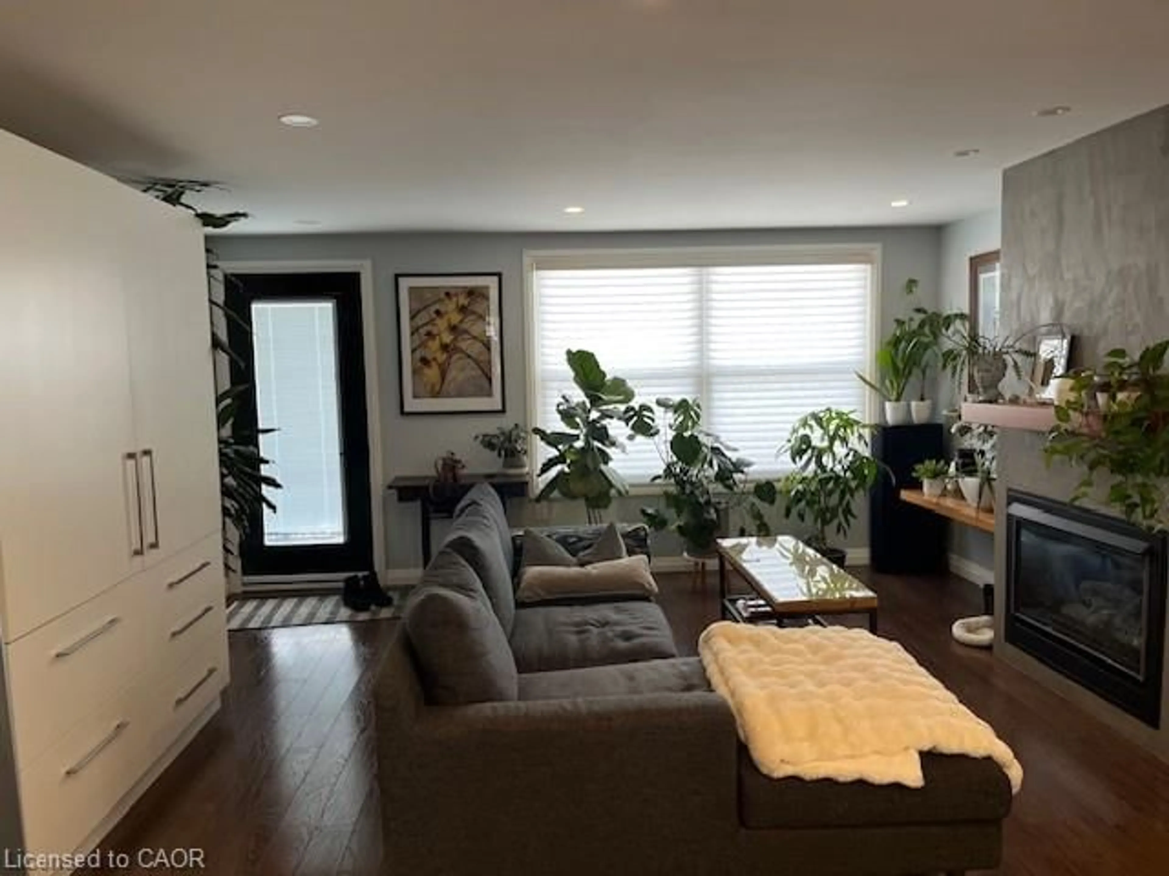 Living room with furniture, wood/laminate floor for 271 Julian Ave, Hamilton Ontario L8H 5S3