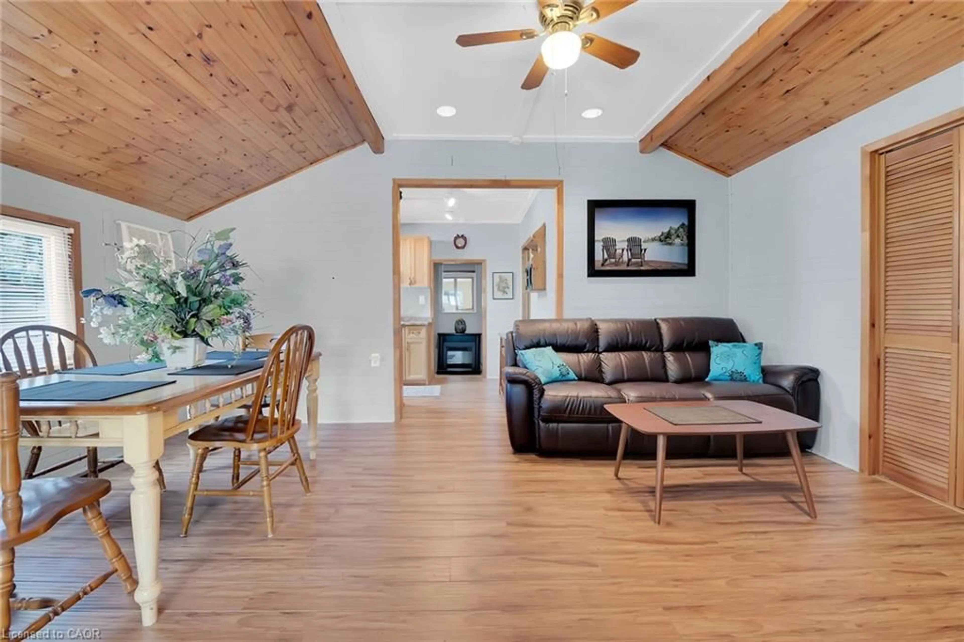 Living room with furniture, wood/laminate floor for 17 Maple Lane, Rainham Ontario N0A 1P0