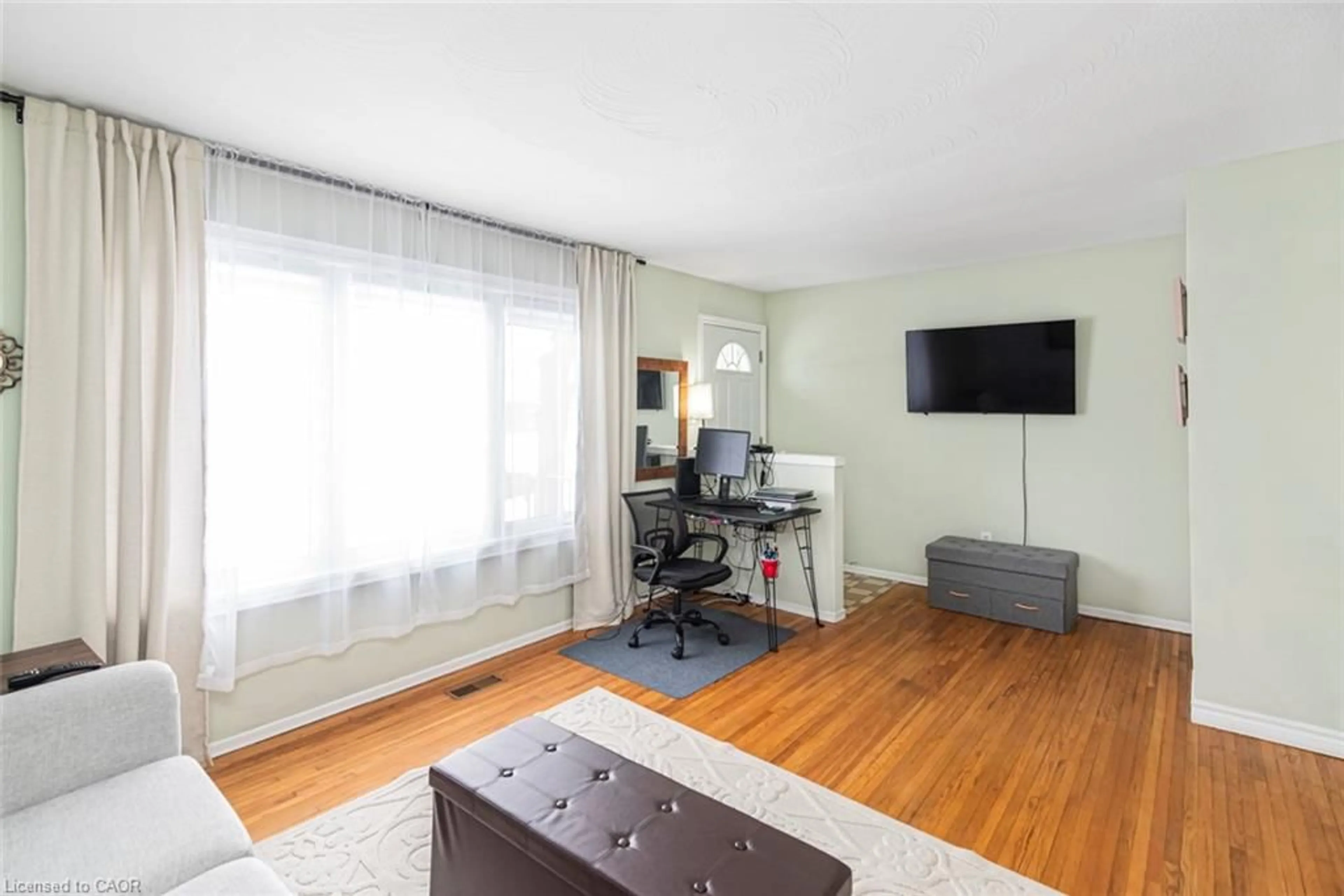 Living room with furniture, wood/laminate floor for 48 Riverdale Dr #2, Hamilton Ontario L8E 1K3