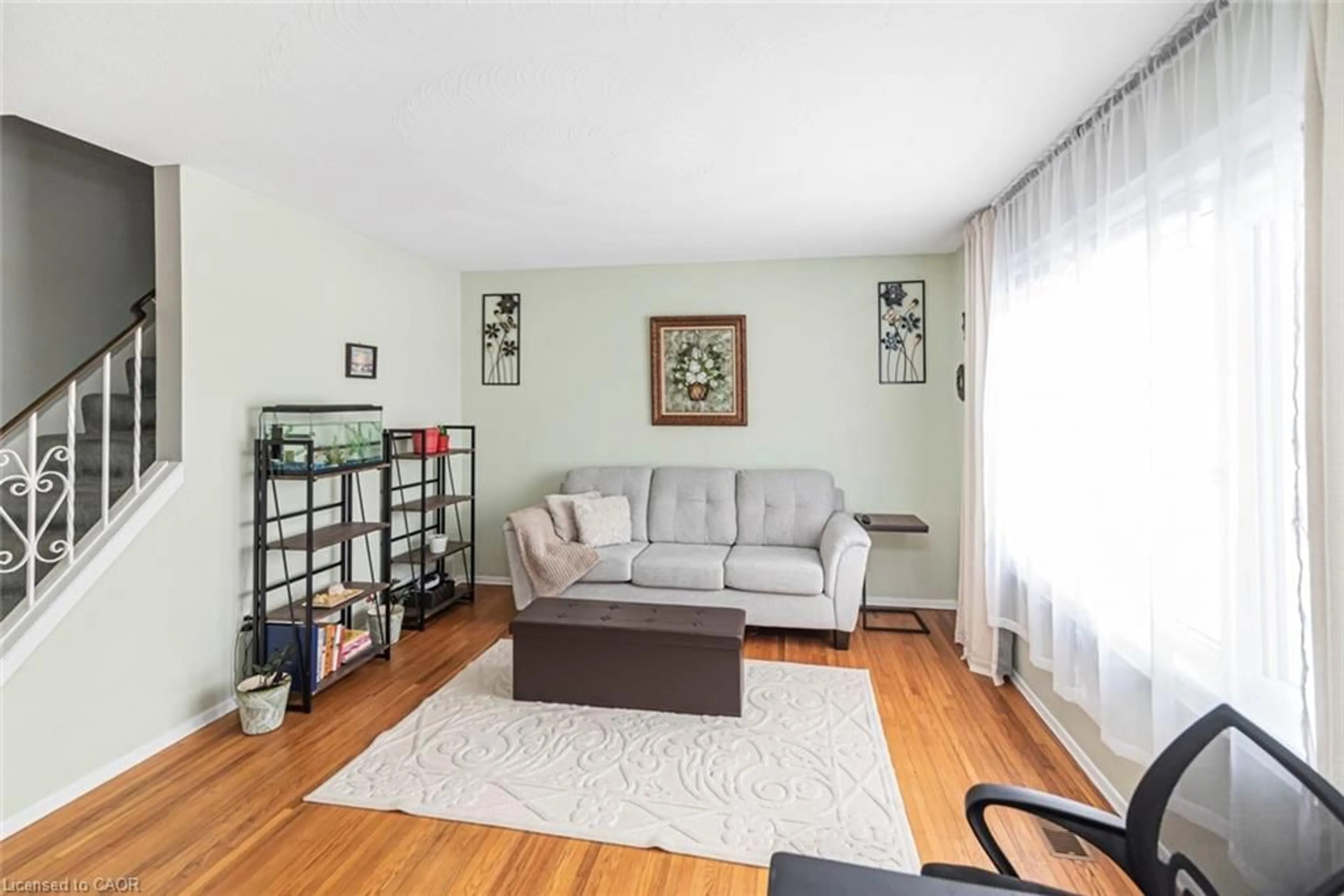 Living room with furniture, wood/laminate floor for 48 Riverdale Dr #2, Hamilton Ontario L8E 1K3