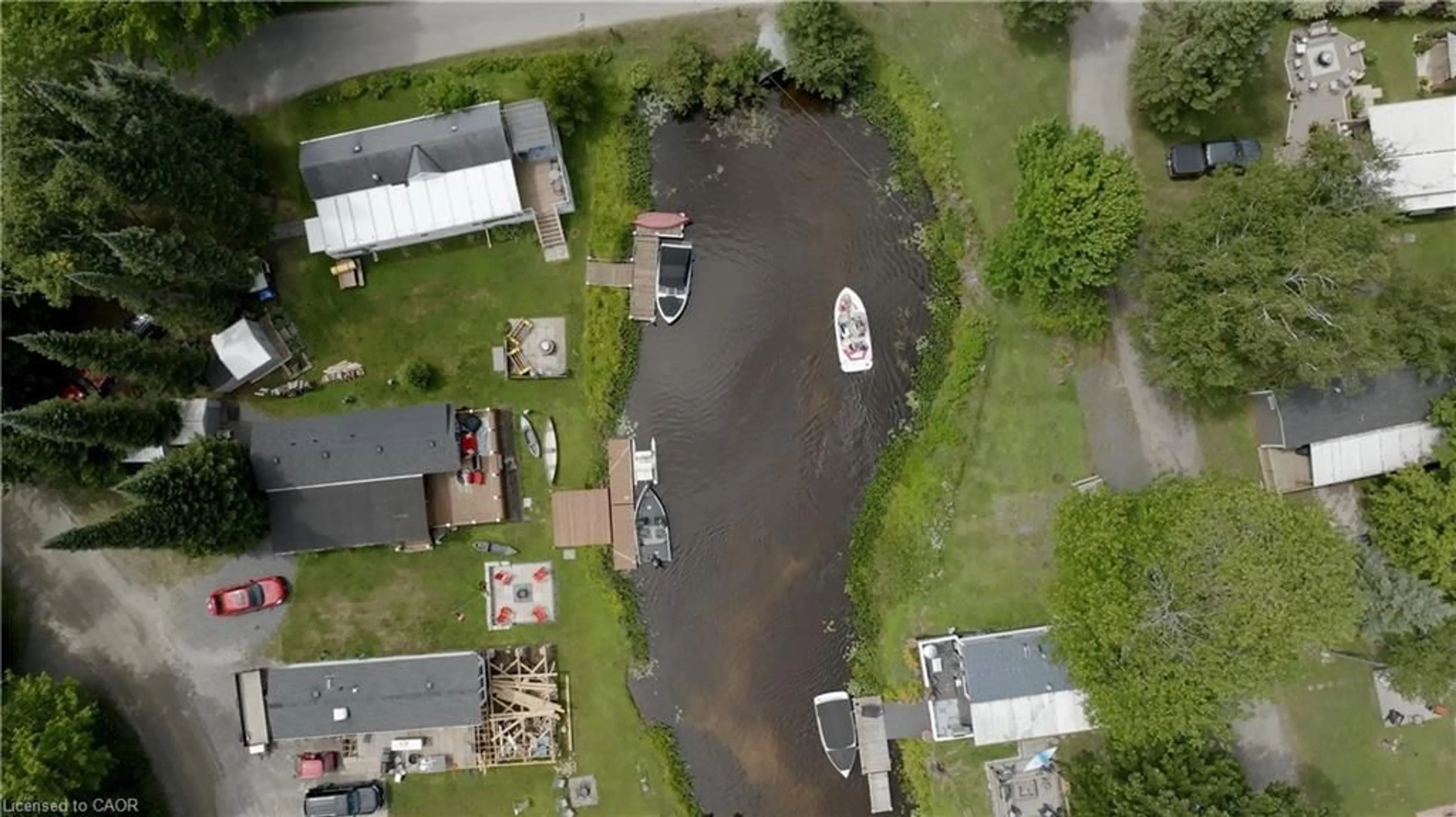 A pic from outside/outdoor area/front of a property/back of a property/a pic from drone, water/lake/river/ocean view for 85 Hutchinson Beach Rd #B56, Huntsville Ontario P1H 1N4