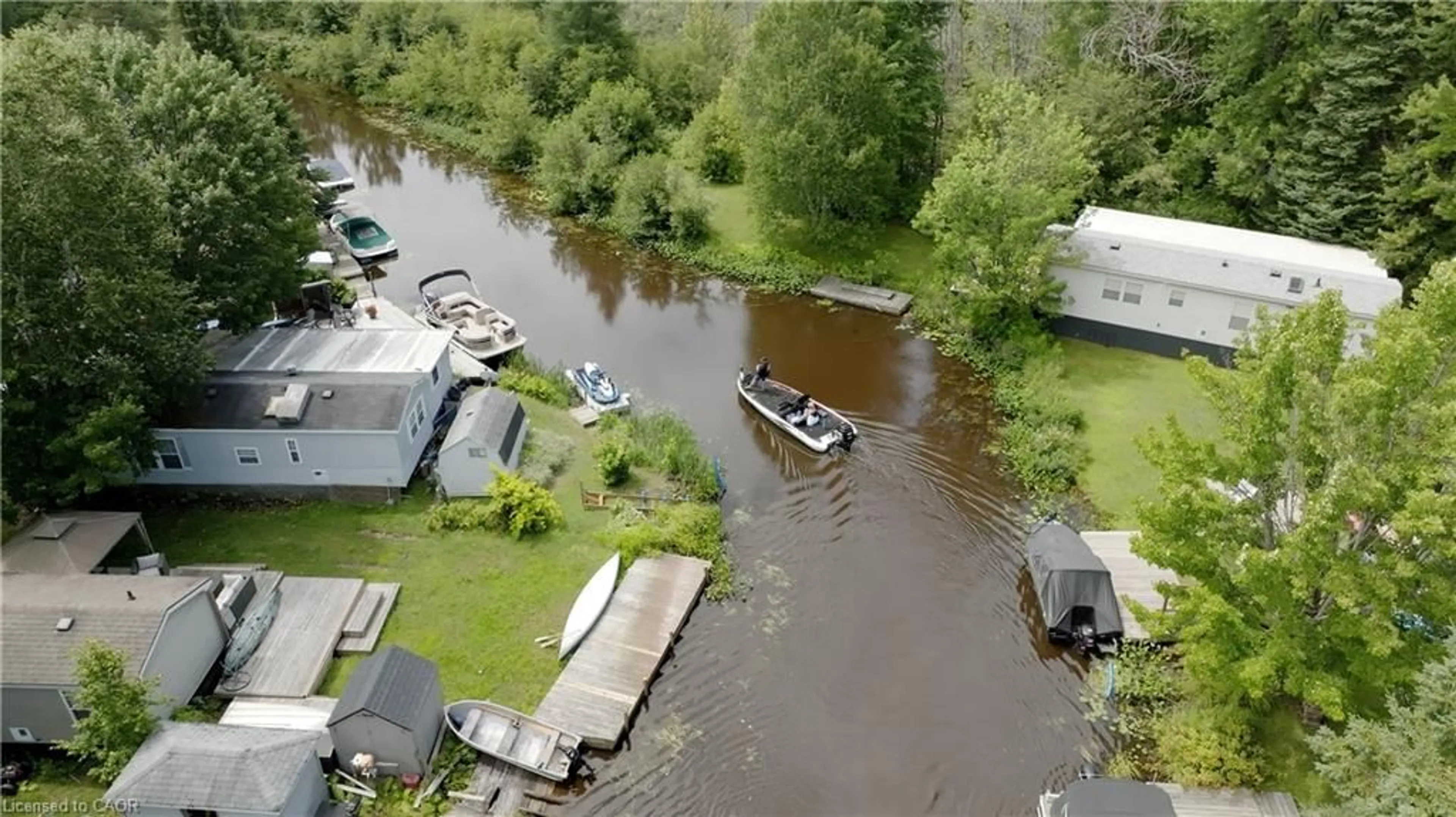 A pic from outside/outdoor area/front of a property/back of a property/a pic from drone, water/lake/river/ocean view for 85 Hutchinson Beach Rd #B56, Huntsville Ontario P1H 1N4