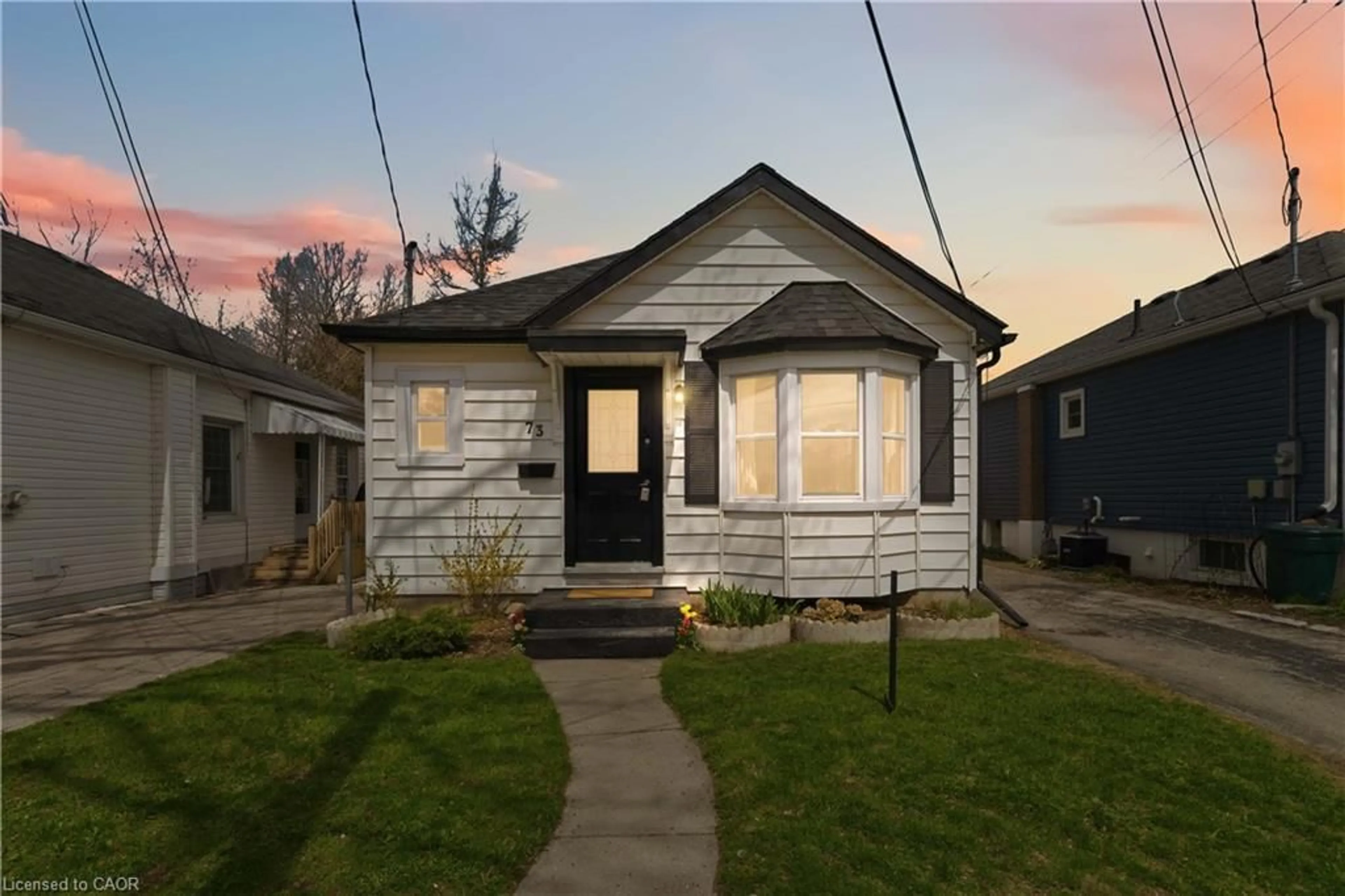 Home with vinyl exterior material, street for 73 St George St, Brantford Ontario N3R 1V5