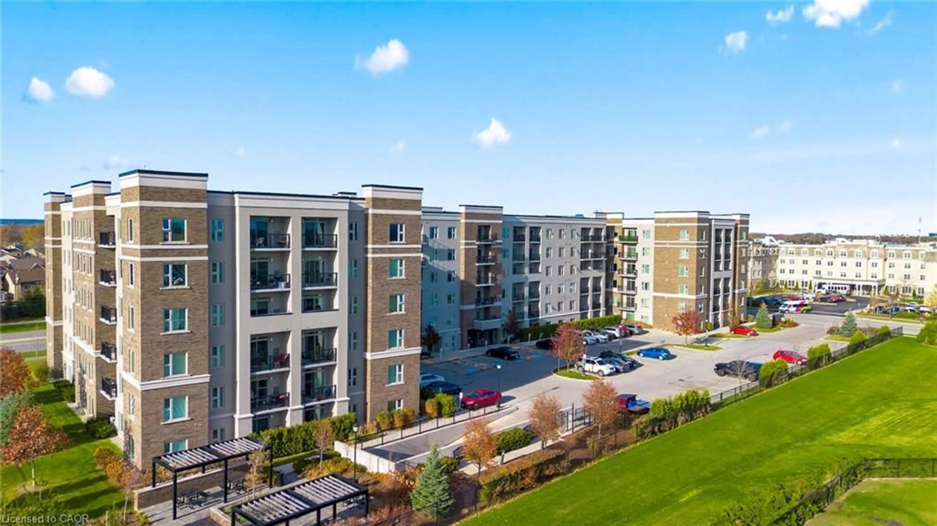 A pic from outside/outdoor area/front of a property/back of a property/a pic from drone, building for 610 Farmstead Dr #304, Milton Ontario L9T 7W2