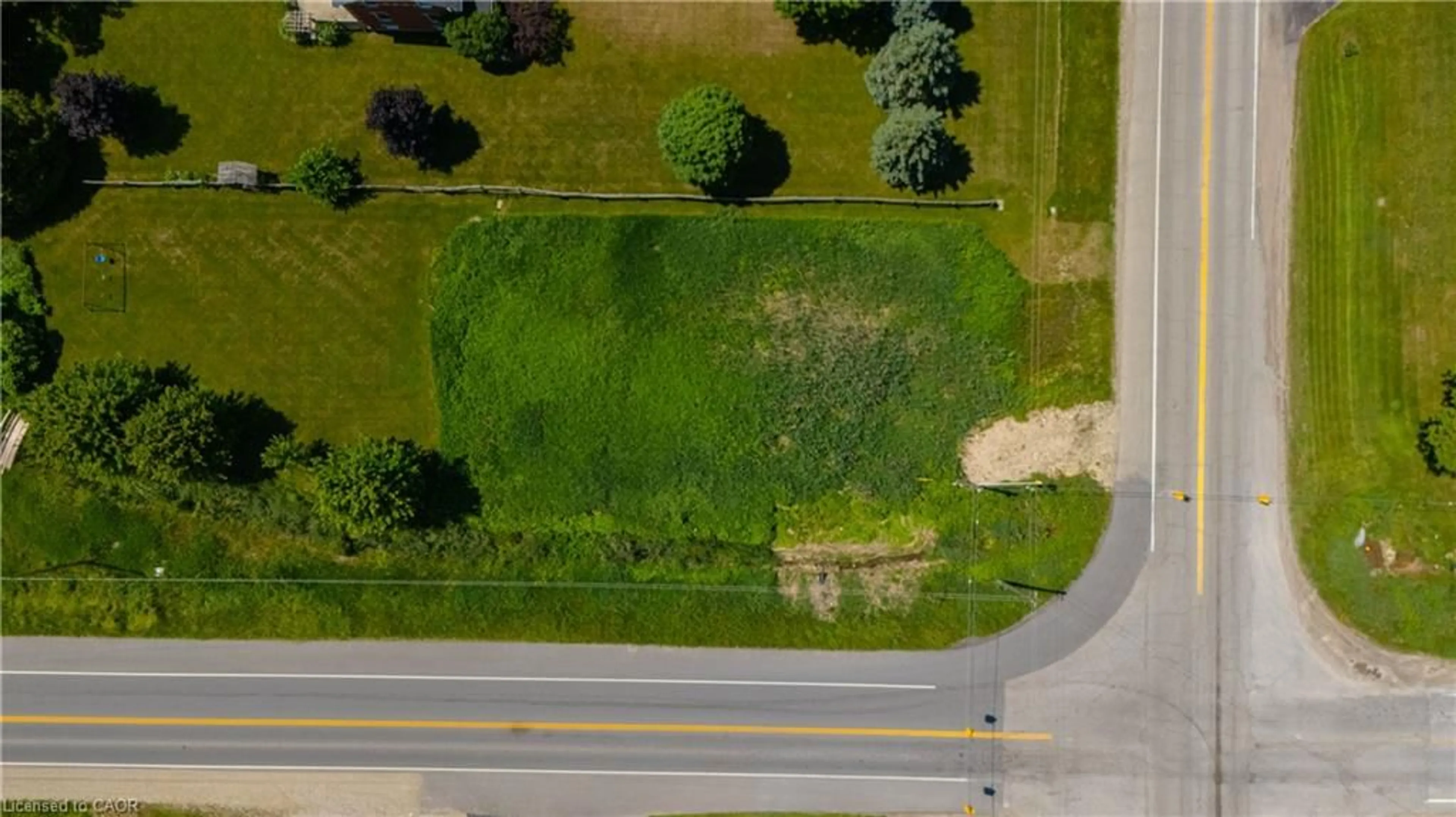 A pic from outside/outdoor area/front of a property/back of a property/a pic from drone, unknown for 7462 Wellington Rd 11, Moorefield Ontario N0G 2K0
