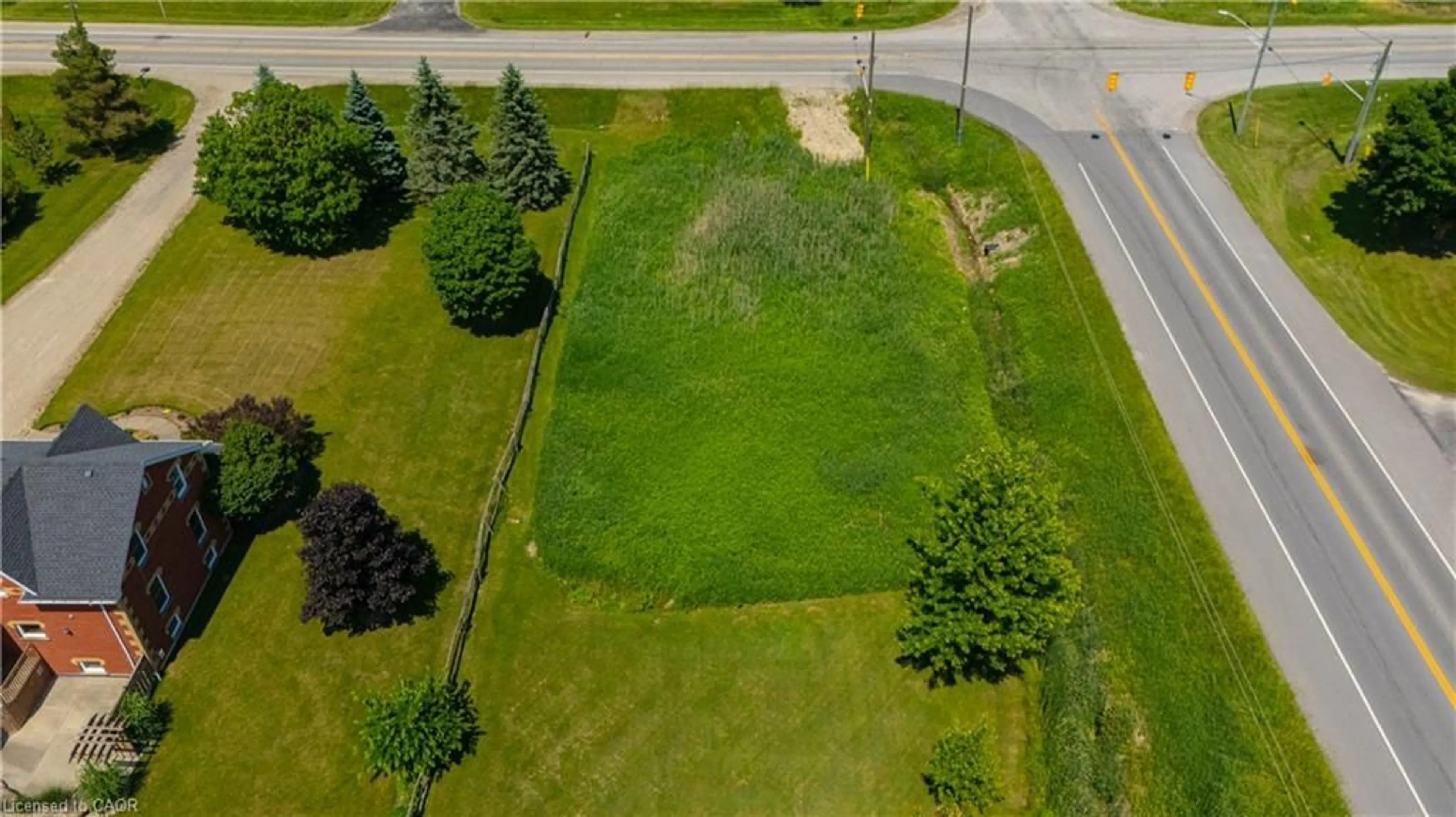 A pic from outside/outdoor area/front of a property/back of a property/a pic from drone, street for 7462 Wellington Rd 11, Moorefield Ontario N0G 2K0