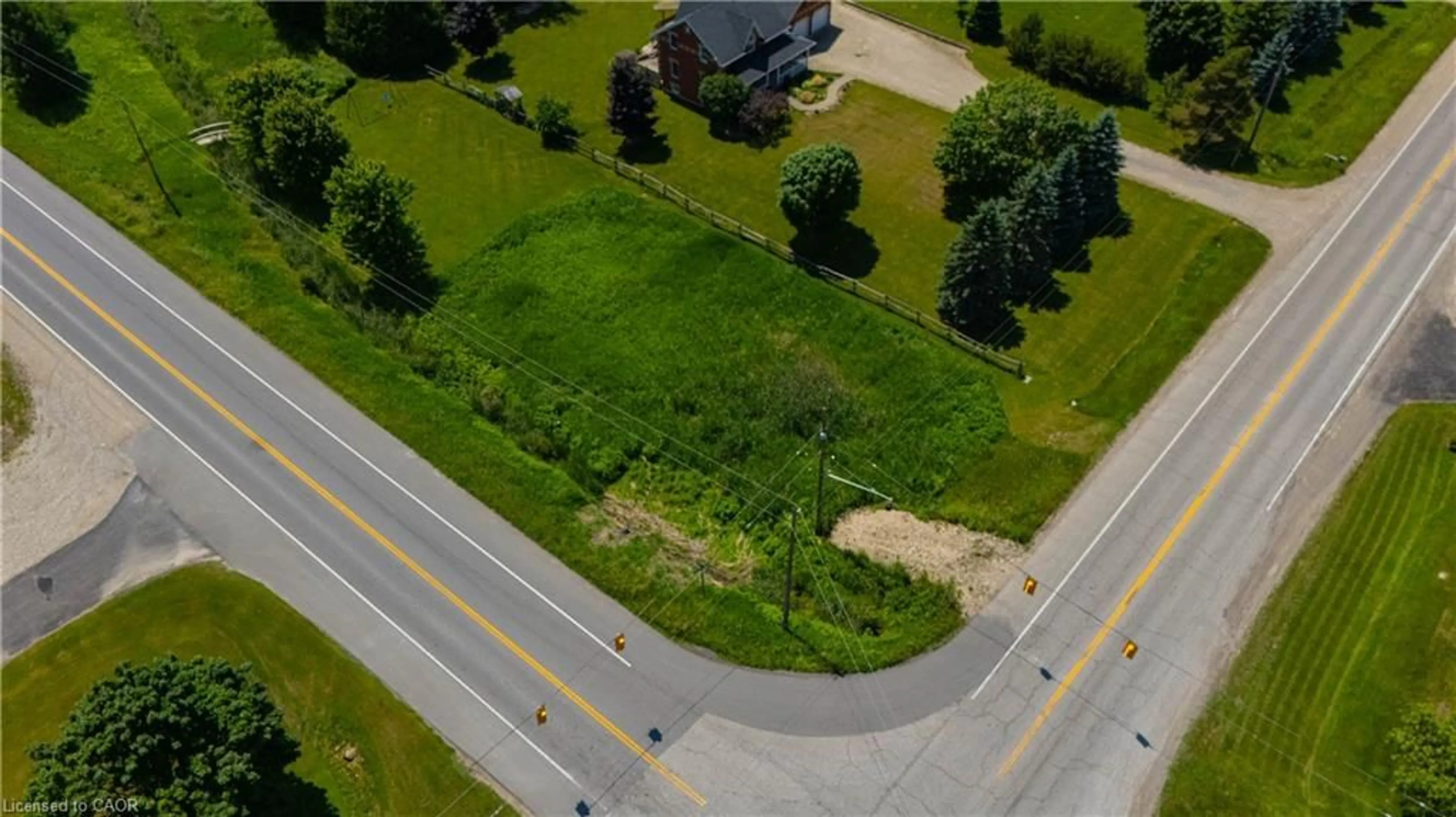 A pic from outside/outdoor area/front of a property/back of a property/a pic from drone, street for 7462 Wellington Rd 11, Moorefield Ontario N0G 2K0