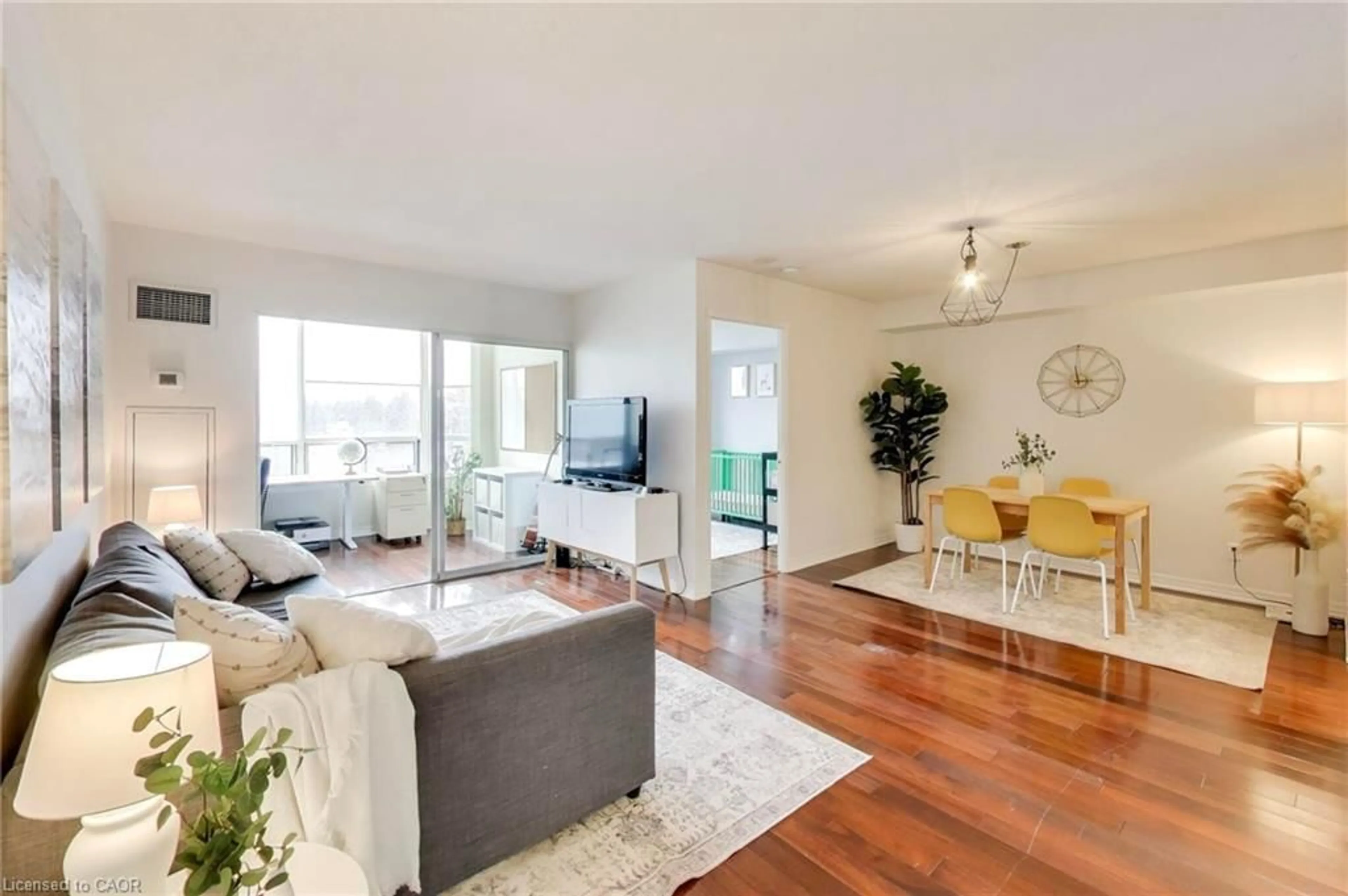 Living room with furniture, wood/laminate floor for 135 Hillcrest Ave #309, Mississauga Ontario L5B 4B1