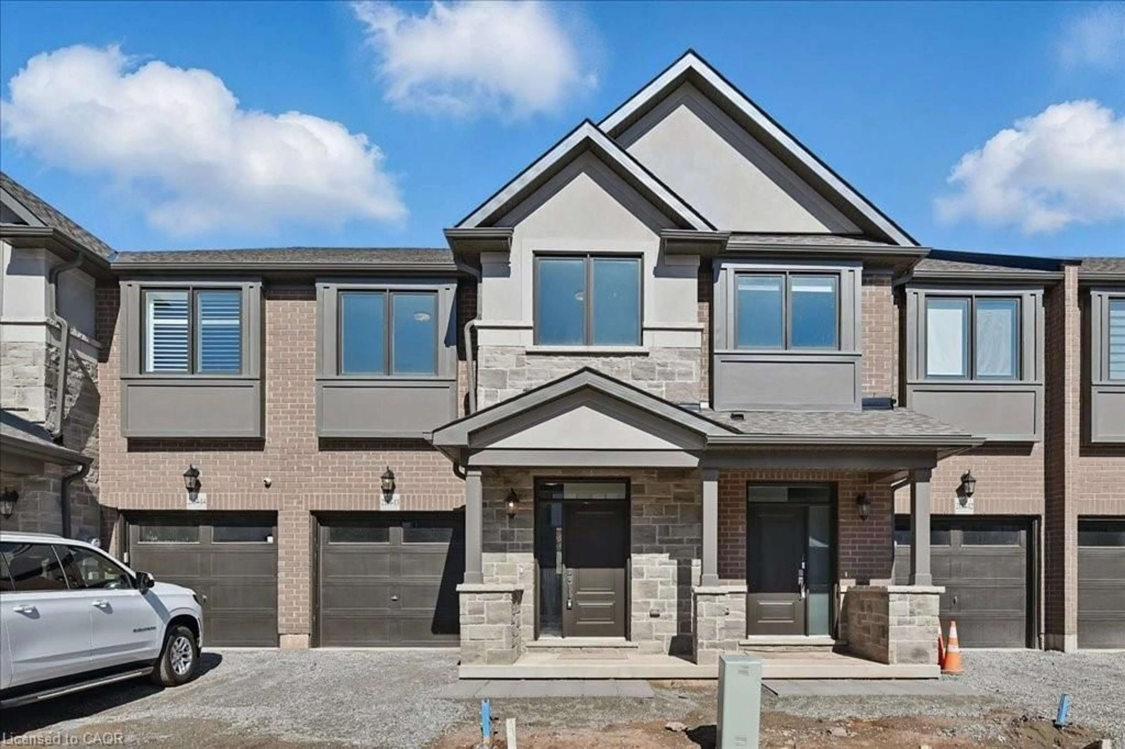 Home with brick exterior material, street for 2184 Postmaster Dr #13, Oakville Ontario L6M 3X1